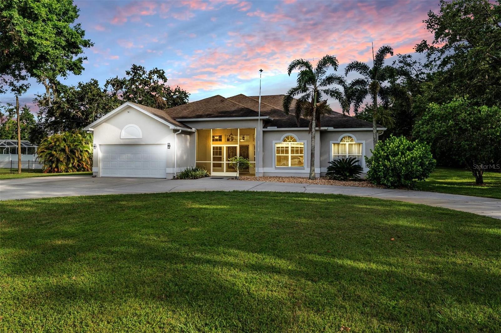 Discover the perfect blend of country charm and modern luxury in this stunning custom-built home on a full acre in the heart of Plant City! From the moment you enter through the stylish double doors, you'll be wowed by the spacious open floor plan, fresh interior paint, warm wood laminate flooring, and beautifully remodeled kitchen featuring granite countertops, stainless steel appliances, and a breakfast bar that flows seamlessly into the living, dining, and family rooms. Imagine cozy evenings by the wood-burning fireplace or hosting unforgettable gatherings with views of the sparkling pool and screened patio! The expansive primary suite is your personal retreat with pool access, a walk-in closet, dual-sink vanity, garden tub, and separate shower. Two additional bedrooms offer privacy on the opposite side of the home, perfect for family or guests. Outside, the possibilities are endless—roam freely, fill the chicken coop, or create your dream backyard oasis on this 1 acre lot! With **no HOA or CDD** and plenty of space for your boat, RV, or toys, this is the freedom-filled Luxury Florida lifestyle you’ve been waiting for. Don’t miss this rare gem, schedule your private tour today!
