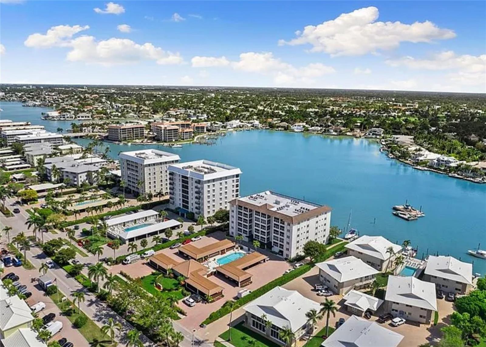 FINAL OPPORTUNITY - Schedule your showing before this gem goes off the market! The epitome of ultimate coastal retreat awaits you in this high and dry 3rd floor corner unit, 2 bedroom, 2 bathroom open concept beach condo! The extra long private balcony is the ideal outdoor space to catch an ocean breeze or enjoy a sunset sky. It overlooks the meticulously kept resort-style pool with a peak-a-boo view of the ocean. Across the street is the easiest of beach access.
The full wall patio sliders reveal the a post card view the moment you enter. Both bedrooms are spacious to fit king size beds. The updated bathrooms and kitchen with custom wood counter give it a sophisticated feel. Store your wine and spirit collection in the customized wine closet. Add your own personal touches to this space for a home that is sure to impress. Furnishings negotiable upon request.
The popular Spindrift Club is in the Moorings neighbor off Doctor’s pass. Spindrift is a quiet, low density building with beach access directly across the street, boat docks for lease, a newly renovated pool with clubhouse, and most importantly, a recently completed milestone inspection.
Ideally located near vibrant coastal shopping and fine dining at Venetian Village is just a short walk from Spindrift Club. This location offers convenient access to Naples attractions including Old Naples, Waterside Shops and Mercato. buyer to verify all measurements. This unit has no land lease restrictions or land lease fees.