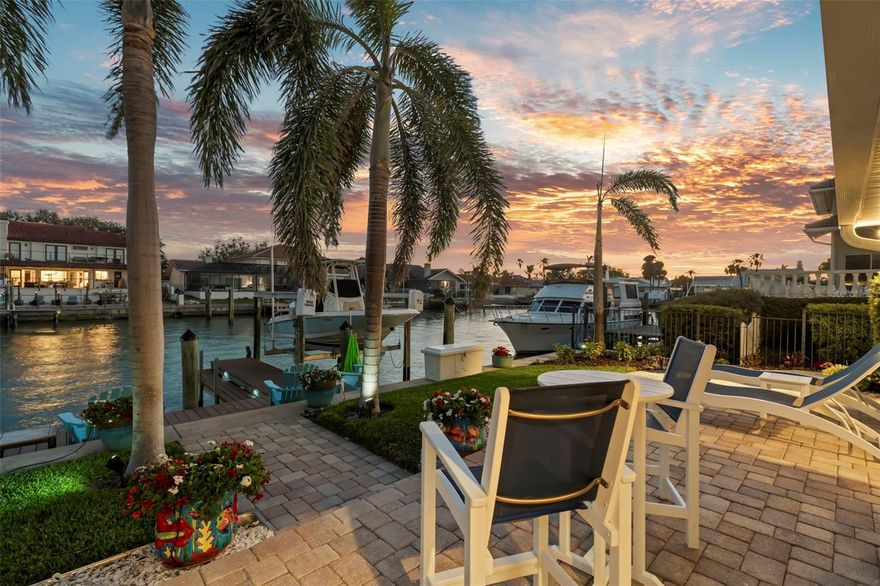 Discover the ultimate waterfront lifestyle in this stunning island home, offering a perfect blend of luxury, comfort, and convenience. With five spacious bedrooms and three elegantly appointed bathrooms, this residence promises an unrivaled living experience. The 24-hour staffed guarded entrance to the island insures both security and privacy. 

Spanning an impressive 2,937 square feet, this exquisite home is thoughtfully designed to maximize both style and functionality. The gourmet kitchen is a chef's dream, featuring top-of-the-line Subzero and Wolf appliances, perfect for preparing culinary delights. The expansive laundry and pantry area enhances everyday convenience, complementing the refined interiors.

Step outside to the fully screened lanai, complete with a heated pool and outdoor kitchen, making it your private oasis for relaxation or hosting memorable gatherings. The property also includes a composite dock with two boat lifts, updated seawall, and direct access to the glistening waters of Tampa Bay, providing world class boating and fishing.

Positioned in the coveted Bayway Isles neighborhood, this home is just a 4-minute drive to the beach and 8 minutes from downtown St. Petersburg, offering easy access to both serene retreats and vibrant city life. Conveniently located near shopping, restaurants and recreational spots like Fort DeSoto and Maximo Park, enriching your living experience.

Whether you're soaking in the scenic views, enjoying the local community’s offerings, or entertaining guests in style, this home is a true gem that caters to an active and comfortable lifestyle.  This home has so many premium upgrades - a must see to appreciate them!