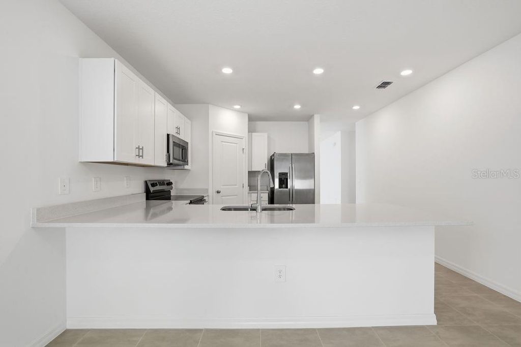 Photo of 13502 Tropical Breeze Way, Hudson, FL 34669 (MLS # TB8437925)