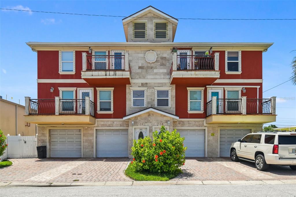 Don't miss this rare opportunity to own 4 short term rentals steps to the beach! Each townhome style unit features a garage plus two bedrooms and a full bathroom. Survey and elevation certificate available. Renters will love the quick access to the beach and walkable distance to food, entertainment and attractions. Units are bright and each has a private balcony. Three of the four units are currently on an annual lease. One is available to begin short term leasing immediately.