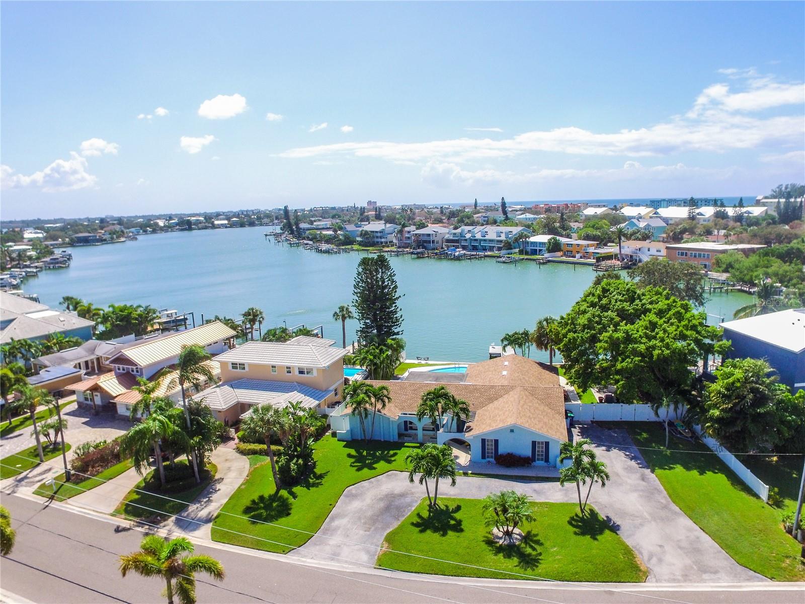 Welcome to your dream waterfront oasis! This exquisite 4-bedroom, 2-bath home is a rare gem, boasting a DOUBLE LOT with an impressive 100 feet of frontage along the stunning Intracoastal Waterway. Located in a highly lucrative area where SHORT-TERM RENTALS are not only allowed but highly sought after, this home offers the perfect blend of tranquility and income potential. Key features include: 2400 Sq. Ft. of Pure Elegance: This spacious 2400 square foot home offers ample space for your family and guests, ensuring everyone enjoys their stay to the fullest. 4 Bedrooms, 2 Baths: With 4 generously sized bedrooms and 2 well-appointed bathrooms, there's plenty of room for everyone to relax and unwind. Open Concept Floor Plan: The OPEN CONCEPT design creates a seamless flow between the living, dining, and kitchen areas, making it ideal for entertaining and creating unforgettable memories. Abundant Natural Light: Enjoy the Florida sunshine pouring in through large windows, filling the home with warmth and vitality. Private 2-Car Garage: Your vehicles will be well-protected in the spacious 2-car garage, offering convenience and security. Refreshing Pool: Dive into your own PRIVATE POOL, perfect for cooling off on hot summer days or enjoying a midnight swim under the stars. Incredible Income Potential: With short-term rentals allowed in this prime location, this property offers a fantastic opportunity for those looking to generate substantial rental income. Imagine the cash flow from nightly rentals! 100 Ft. of Intracoastal Frontage: The Intracoastal Waterway is your backyard playground, providing breathtaking views and direct access to boating, fishing, and watersports. Only 0.3 MILES from Indian Rocks Beach: WALK just a few steps, and you'll find yourself on the sugary sands of Indian Rocks Beach, where you can soak up the sun, swim in the Gulf of Mexico, and enjoy the relaxed coastal lifestyle. Don't miss this chance to own a piece of paradise with the potential for significant financial gain. Whether you're seeking a personal sanctuary or a lucrative investment, this double-lot home on the Intracoastal Waterway has it all. Act quickly to secure your piece of the Florida dream!