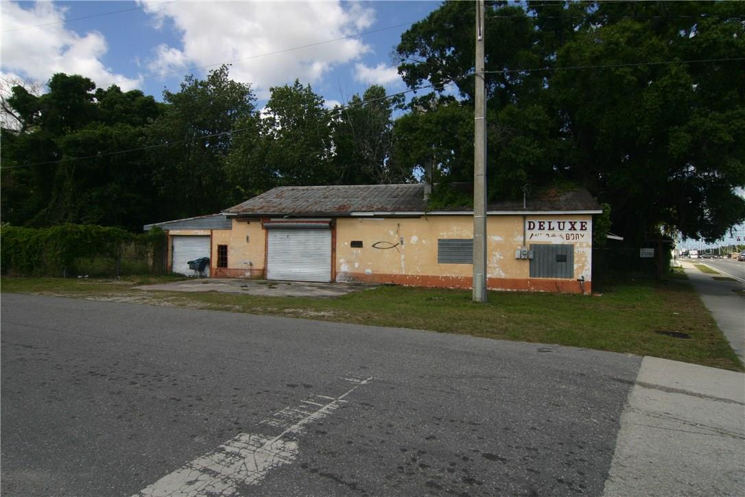 This is a Commercial Property zoned C3...(grandfathered)..It has a warehouse which was used to paint and repair autos which has had some work done to it. and estimating approx 2000 sq ft ..It is fenced and includes another small parcel making the acreage at approx 1.2 acres ..The property sits on Old Winter Garden Rd or Washington St and Georgiana St..just around the corner from Hwy 408 and minutes to downtown Orlando and the newly remodeled Citrus Bowl..just think of the opportunities here..this is a very Central location just blocks away from Downtown Orlando and the Citrus Bowl..right next to and behind the Property on the corner of John Young & Old Winter Garden with still visibility from John Young... Possibilities MIGHT include billboard rental and with a C3 zoning is a true plus.allows a great deal of businesses.