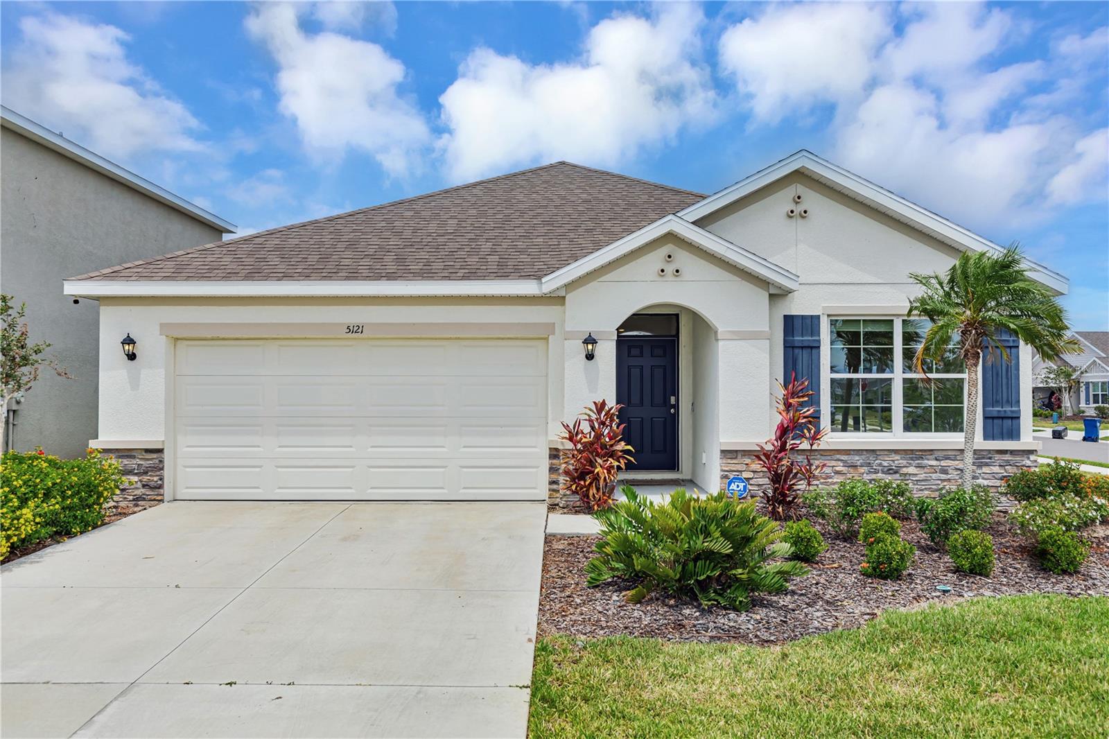 One or more photo(s) has been virtually staged. Located in the beautiful and highly sought after Solera community at Lakewood Ranch, this immaculate Aria model by the #1 builder in the Nation, D.R. Horton, checks all the boxes. Beginning with the exterior, this home exudes curb appeal with its large, beautifully landscaped corner lot. Currently, the ONLY corner lot home for sale within the Solera community! Walk through the front door and be amazed by the attention to detail of this clean, one owner only, like new home that features 3 large bedrooms and 2 bathrooms. This true, open concept home is perfect for entertaining family and friends with its large kitchen island. The kitchen is open to the living room, making this perfect space the heart of the home. Kitchen also includes well-appointed stainless-steel appliances, granite countertops, and all the natural light you need. The large master suite includes a walk-in closet and large master bathroom with his and hers sinks. The home also has an interior laundry room that includes washer and dryer. The list goes on and on as the home also features the "Home is Connected", America's Smart Home Package. Walk out through the 2 panel, sliding glass door into the serene, rear lanai and sip your morning coffee as you take in the beautiful Florida weather and enjoy views of the lake. The large backyard has plenty of room to build your own private pool oasis. Additional features include large ceramic tiles, 2 car garage, irrigation system, and storm shutters. Community amenities include lawn maintenance, beautiful resort-style pool/clubhouse, and a tot lot for the kids. Location, location, location...conveniently located just minutes away from I-75 and near some of the best attractions Sarasota and Bradenton, Florida have to offer to include University Town Center (UTC) mall, and the award-winning Siesta Key Beach. Call today and schedule your private showing and make 5121 Sultana Cove your new haven, where every day feels like a vacation.