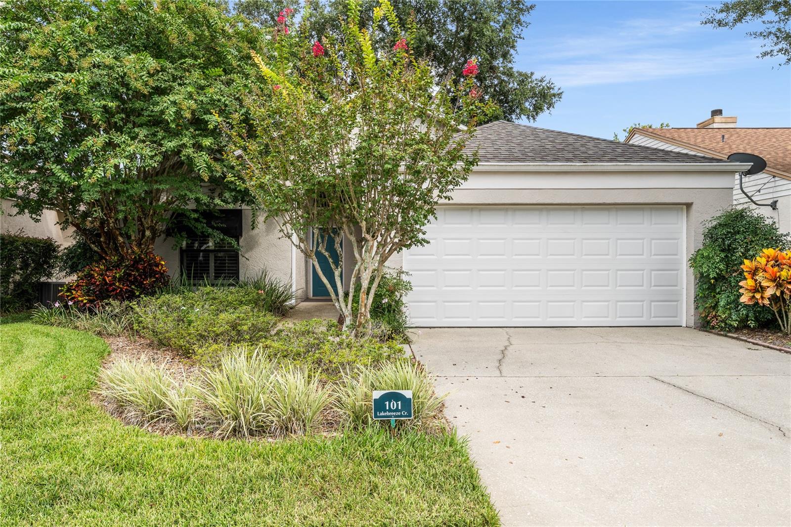 First Time Ever Offered! Charming Home in Lakebreeze Village – The Crossings of Lake Mary
This one of Seminole County’s most sought-after communities, tucked within the established and serene Crossings of Lake Mary. This is a rare opportunity to own a solidly built 3-bedroom, 2-bath home in a top-rated school district—Greenwood Lakes Elementary, Greenwood Lakes Middle, and Lake Mary High.
Situated on a quiet, tree-lined street, this well-maintained one-story home offers over 1,300 square feet of flexible living space, perfect for first-time buyers ready to update and make it their own.
The charming exterior, surrounded by lush landscaping, welcomes you with a decorative teal front door opening into a dramatic 17-foot foyer. The formal living room features gleaming maple hardwood floors, vaulted ceilings, and modern ceiling fans, offering a warm yet spacious atmosphere. Natural light pours into the adjacent family room, accented by custom blinds and multiple windows.
The kitchen boasts white cabinetry with oak-tone accents, neutral tile countertops, a stainless-steel sink, and a full appliance package. It flows seamlessly into a cozy sitting nook, offering endless possibilities for open-concept updates.
The private primary suite, located in its own wing, showcases rich wood flooring, white plantation shutters, a walk-in closet, and a spa-inspired bath with dual walnut vanities, picture-frame mirrors, and a beautifully tiled walk-in shower.
Double French doors lead into a versatile secondary bedroom with a built-in entertainment center—ideal for a guest room, home office, or den.
Step outside to the screened-in patio, overlooking a generously sized backyard blooming with color. It's the perfect canvas for outdoor entertaining, gardening, or adding a pool.
Enjoy peace of mind with major updates already completed, including a newer roof, HVAC system, and water heater.
Just minutes from Lake Sylvan Sports Complex, Seminole Soccer Complex, SunRail, shopping, dining, and major highways, this home offers convenience, charm, and outstanding potential.
Don't miss your chance to create something special in one of Lake Mary’s most desirable neighborhoods. Schedule your showing today!