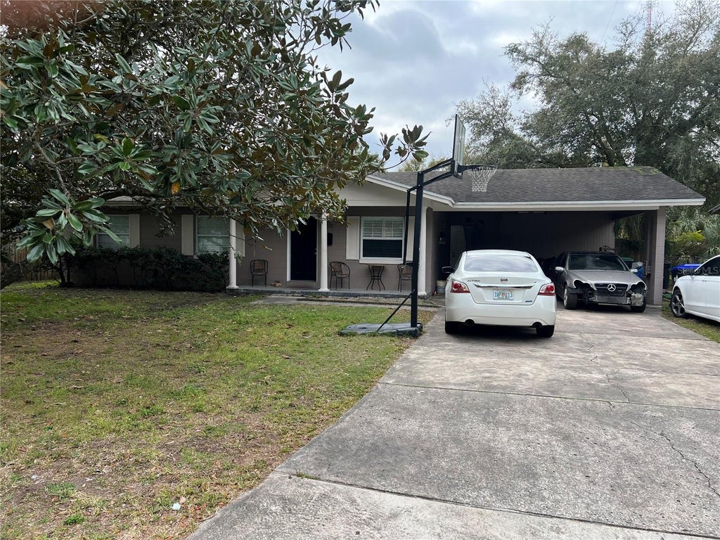 Photo of 830 Baltimore Dr, Orlando, FL 32810 (MLS # O6440373)