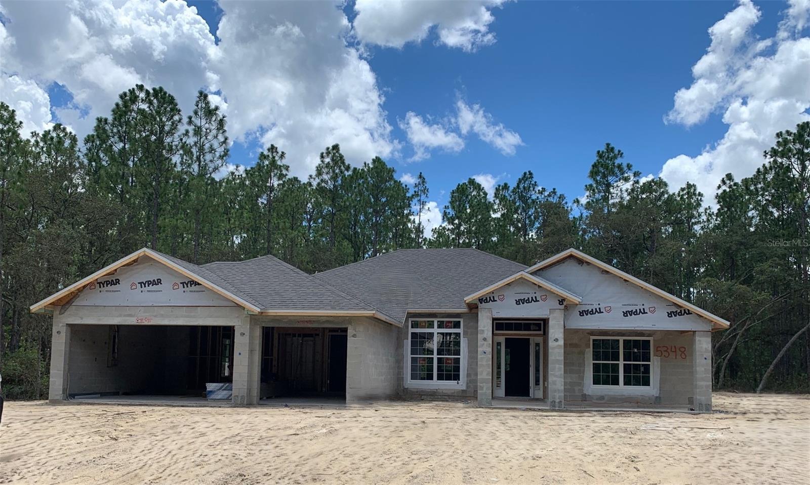 Under Construction. BRAND-NEW, QUALITY BUILT 4BED, 3BATH, 3CAR GARAGE HOME! This home is located in the sought after PINE RIDGE ESTATES, EQUESTRIAN COMMUNITY on a 1.07-acre homesite. Need a fence? You can have it! Need a shed? You can have it!! Have a horse? You can have it here!! Come join this beautiful community! Hurry in!! This home is at 45% completion and moving right along!! Seller pays closing costs w/approved lenders.
Upgrades included in this home: WOOD LOOK TILE EVERYWHERE EXCEPT BEDROOMS; WOOD SHAKER CABINETS; GRANITE COUNTERTOPS W/UNDERMOUNT SINKS THROUGHOUT HOME, THREE CAR GARAGE; COVERED FRONT PORCH; COVERED BACK LANAI; DOUBLE DOOR ENTRY TO FORMAL LIVING ROOM; SEPARATE TILE SHOWER W/LIGHT & SHOWER DOOR IN OWNERS BATH; TRAY CEILING W/CROWN MOLDING IN OWNERS BEDROOM; STAINLESS STEEL APPLIANCE PKG; MINI BLIND INSERTS IN BACK DOORS TO COVERED LANAI. TAEXX PEST CONTROL SYSTEM BUILT IN; BUILDER AND THIRD-PARTY WARRANTY INCLUDED!