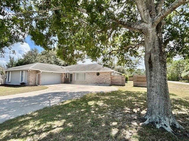 Fishermans Paradise - Bring the Boat, the RV, The vehicles- No HOA! Extra large 1/3 Acre lot. Large open floor plan with cathedral ceilings, bedrooms plus office/den & (2) full bathrooms, great room overlooks large screened in patio and private partially fenced back yard. Kitchen features lots of cabinets and counter space, tile backsplash & all appliances included. All tile and laminate flooring. Inside laundry room. Utility shed 16x16 included. Water softener, Water purifier. A/C (2023). Hurricane shutters included, 2 Car garage w/utility basin. Close to multiple boat launches.