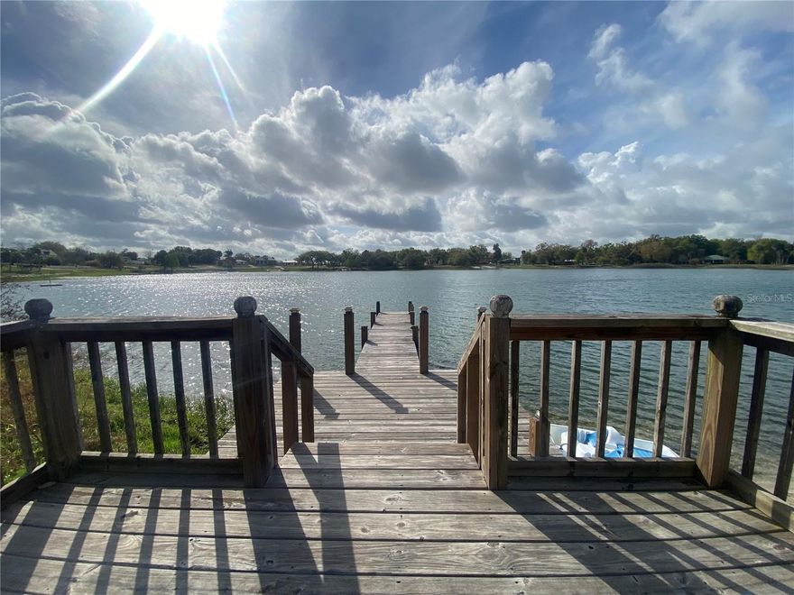Lakefront + the option of a Turnkey Vacation Rental = Rare Opportunity! Whether you're looking for a relaxing home or an investment property, this St. Anne Lake gem checks all the boxes. Enjoy the relaxed Florida lifestyle in this charming lakefront home & community which can be perfect as a full-time residence or a peaceful weekend retreat - this home offers quiet serenity and beautiful lake views with superb sunrises. Over the past few years, the home has been thoughtfully remodeled with new flooring, recessed lighting, double-pane windows, a new hot water heater, A/C in 2017 and for added peace of mind, a new roof will be installed prior to closing.  Your private backyard space comes complete with an above-ground pool—perfect for cooling off on warm Florida days. The backyard detached outbuilding, was previously used as an in-law suite with bedroom & bath; it's currently used for storage and could be converted back.  This home is part of a successful vacation rental program and is being offered turnkey and ready to go for buyers interested in continuing the rental opportunity.  Whether you’re looking for a serene lakefront home or a ready-made investment property, this one offers the best of both worlds.