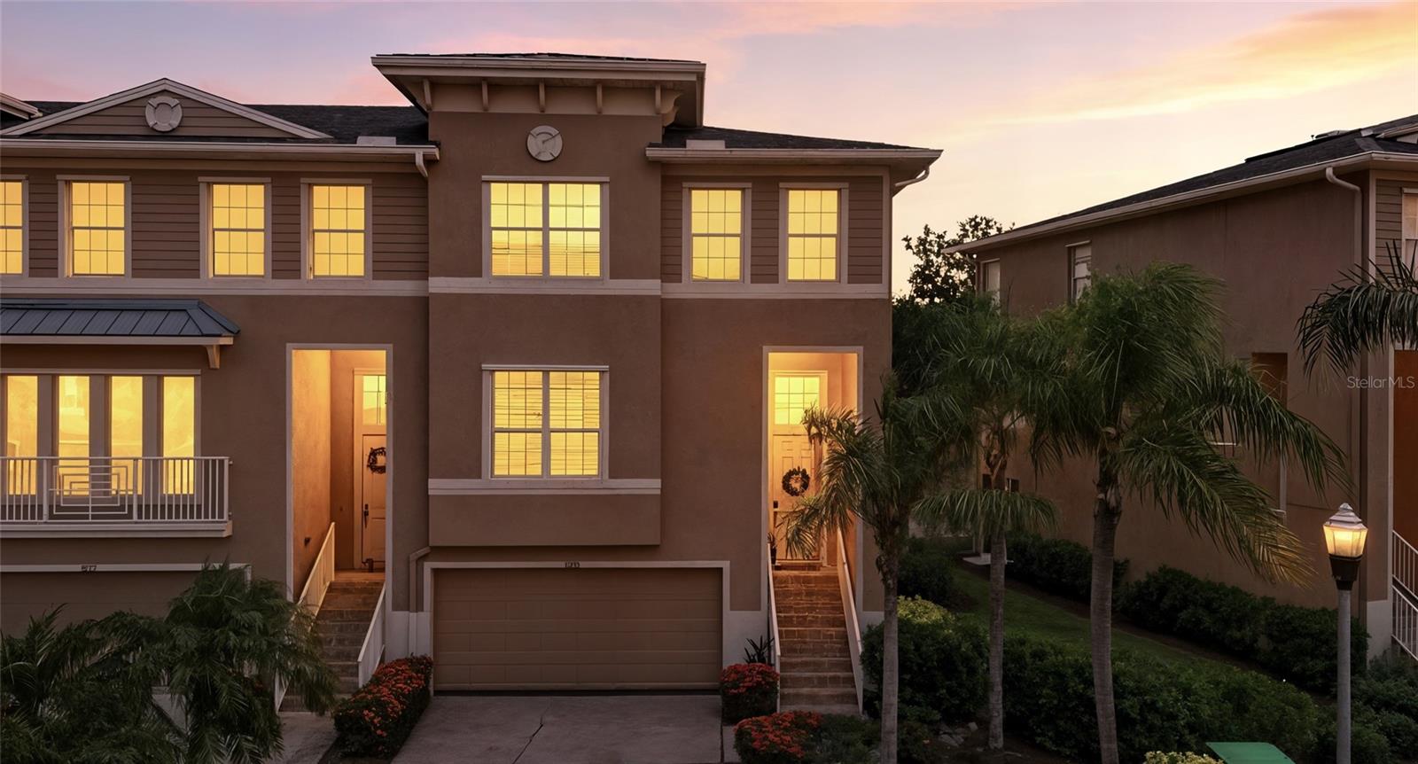 Where do we even begin with all the upgrades in this truly exceptional home-easily the best to hit the market in the highly sought-after gated community of Seminole Isle. From the moment you step inside, you'll notice the attention to detail, starting with all-new luxury vinyl flooring and updated subfloors throughout the first level. The spacious living room is perfect for entertaining, complete with built-in speakers and smart lighting to set the perfect mood. Just off the main living space is a cozy reading nook that could easily be converted into a formal dining room if desired. The triple sliding glass doors fully retract, opening the entire space to a beautifully tiled and screened-in lanai with breathtaking views of the serene pond. A perfect spot to unwind at the end of the day. The kitchen is a chef's dream, featuring updated white soft-close cabinetry, an oversized island with convenient pull-out drawers, granite countertops, a breakfast bar, and a charming eat-in dining area. Newer appliances round out the functionality of this stylist space, making meal prep and entertaining a breeze. Upstairs, you'll find updated engineered hardwood flooring and a bright sitting area that adds a touch of versatility to the layout. Double French doors lead to the spacious master suite, thoughtfully designed with ample room for all your wardrobe needs. The luxurious en-suite bathroom offers dual vanities, a walk-in shower, walk-in closet, private toilet, and stunning tile flooring that ties the whole space together in a modern spa-like aesthetic. The guest bathroom offers dual access and continues the theme of comfort and convenience. Step outside to the ground-level patio, where tasteful tile work, not just a basic concrete slap, provides an additional spot to relax with another gorgeous water view. The rare 4-car attached garage offers incredible storage and parking flexibility, whether for vehicles, a home gym, kayaks, or all your outdoor gear. Seminole Isle is a premier gated community with a kayak launch, scenic walking trails, and a beautiful community pool and clubhouse. Don't miss your chance to own this move-in ready masterpiece, and upgraded home in one of Seminole's most exclusive and amenity-rich neighborhoods. This one will go fast, schedule your showing, and don't miss out on this gem!