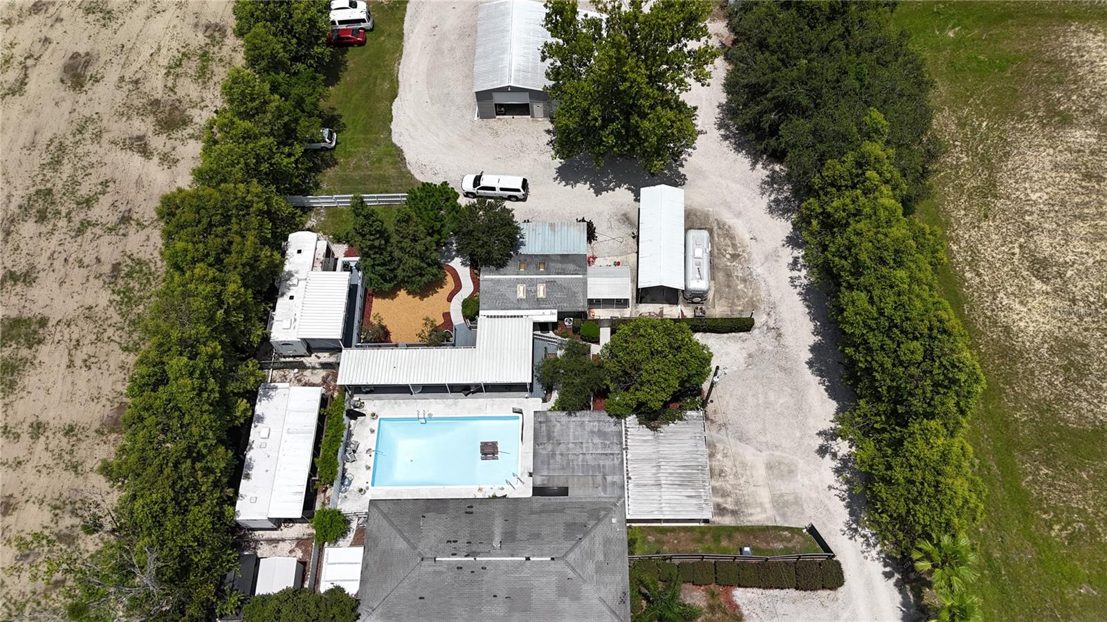 Rare 1.36-acre mixed-use development opportunity on Clubhouse Road
Located at the high-visibility intersection with US-98 south, this versatile property features a solid 1,736?sq?ft, 3-bed/2-bath masonry home built in 1969, plus a detached shop with large shop that includes full electrical, insulated ceiling, all on a 6 inch concrete slab. The lot is currently zoned RL3X residential, but offers immediate potential to be rezoned OCX (Office Center) or even TCX (Town Center Mixed-Use) to accommodate a range of light commercial uses—ideal for an office, medical, restaurant, retail concept or combination.
Positioned across from a Publix-anchored shopping plaza, adjacent to multifamily and professional office uses, and just south of the Polk Parkway/SR?60 corridor, the parcel offers premier access and visibility. Municipal utilities and road retention are already in place nearby. Perfect for developers, investors or business owners seeking a strategic site with both residential utility now and commercial upside ahead. Don’t miss this opportunity to transform a solid home into a lucrative mixed-use asset.