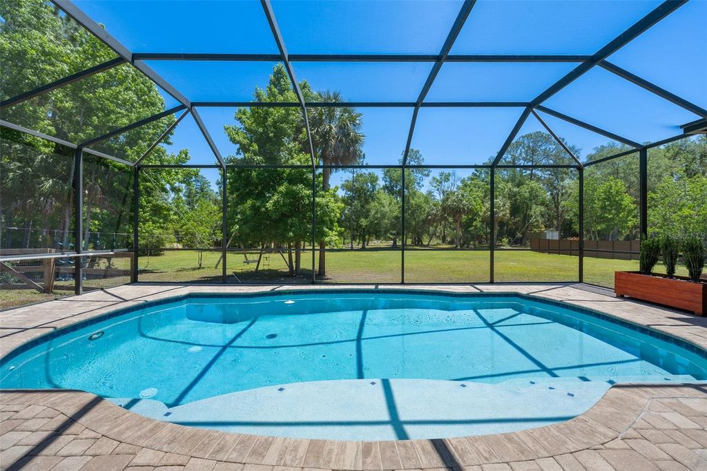 Photo of 8224 Spring Forest Lane, Wesley Chapel, FL 33544 (MLS # TB8508179)