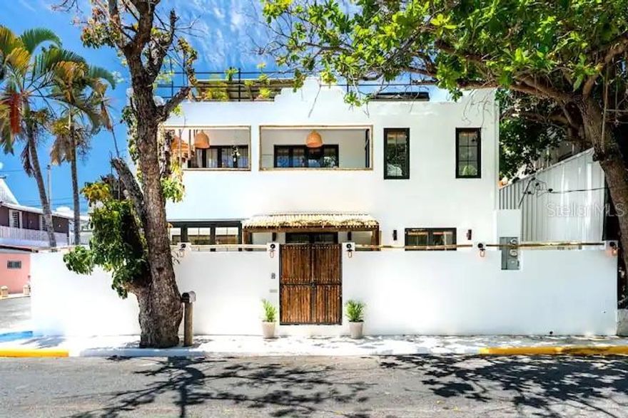 Find your oasis in this boutique one-of-a-kind property. 

Located in Ocean Park this recently renovated property houses 2 apartments totaling 6 bedrooms, 5 full bathrooms, a private pool area, and a large rooftop terrace with a hot tub & an outdoor grill. 

This home boasts impeccable attention to detail with tropical vibrant colors and prints, woodwork and a sleek design. Both apartments are equipped with attractive, modern kitchens and cozy lounge areas. Each kitchen is outfitted with new appliances, full sinks and plenty of counter space. 

The first floor apartment has two queen bedrooms and one bunk room with twin bunk beds. The queen bedrooms have their own private bathrooms with spacious showers. This unit also has another full bathroom located off the main living space.

The second floor unit has two queen bedrooms and one room with two single beds. 

Both the pool terrace and the rooftop have sinks and gas grills. The living rooms feature a sofa and flat-screen Smart TV. The first floor apartment has a light-filled working area right off the living room.

Your private oasis is just steps from one of the most popular beaches in Puerto Rico & walking distance to numerous popular restaurants, bakeries, bars, surf shops & pharmacies / grocery stores. The villa is equipped with everything you'll need!

The property is an income investment opportunity that currently caters to short-term rentals such as Airbnb.