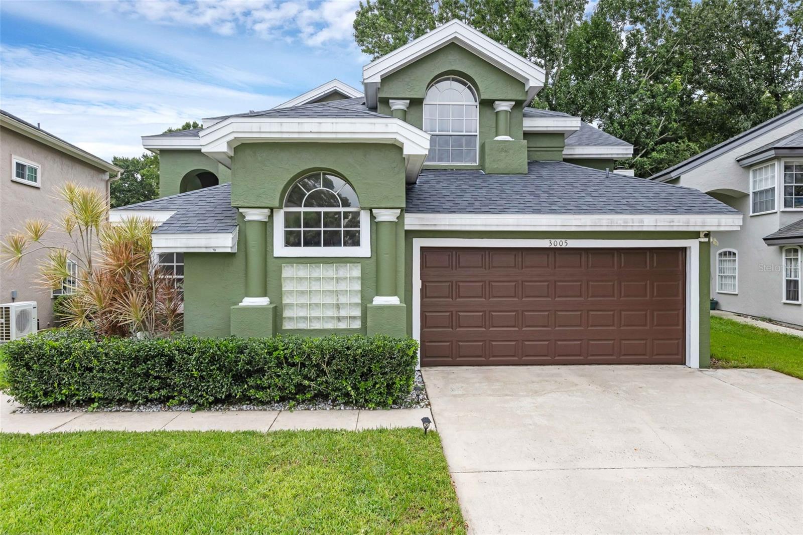 There are move-in ready homes, and then there is "3005 Mystic Cove" move-in ready....and you'll see the difference! Conveniently located in the Conway area, this smaller community is easily accessible to anything that you may need within minutes; including Publix, medical facilities, an abundance of restaurants and cafes, and a stone's-throw away from downtown Orlando & Lake Eola. Once across the threshold, you can immediately begin to appreciate all of the updates that these homeowners have done for you; and the "wow-factor" is inescapable as you are greeted by 20' vaulted ceilings, a floor to ceiling stone fireplace, and custom wood accents on the grand staircase. New laminate flooring leads your eye from the front door and all around the first floor, and compliments each tasteful update at every turn. Your primary bedroom is located on the first floor for added privacy, and has its own en-suite bathroom that would rival any 5-star hotel. Floor to ceiling tile, quartz vanities, a custom walk-in closet, and a colossal size shower, with an intricate linear floor drain...can you imagine getting ready in this space every morning? Your family room and dining are the nucleus of the home, and have more than sufficient space for all of your larger furniture pieces. Do you like to cook and entertain? Are you the "go-to" person in your family who is normally nominated to host the family dinners and holidays.....well you'll be the envy of your circle now with this stunning kitchen! Top to bottom this kitchen will not disappoint or fall short in any way. Custom quartz countertops & matching backsplash grace this area from every angle, with natural wood colored cabinets and dark hardware and stainless steel appliances making this designer kitchen a 10/10. Newer slate-colored Samsung appliances are the icing on the cake, and will make cooking at home a joy from now on. Three large sized bedrooms are located upstairs, as well as another stunning updated full bathroom that services them. 2023 ROOF | HVAC INSTALLED 2021 | (2) NEW SLIDING DOORS | NEW EXTERIOR & INTERIOR PAINT | NEW LVP THROUGHOUT | EVERY BATHROOM IS UPDATED | CUSTOM CENTERPIECE STAIRCASE | LOW HOA | NO REAR NEIGHBORS | ZERO CARPET...this list goes on and on! Don't you deserve to be excited to walk into a home like this every day?