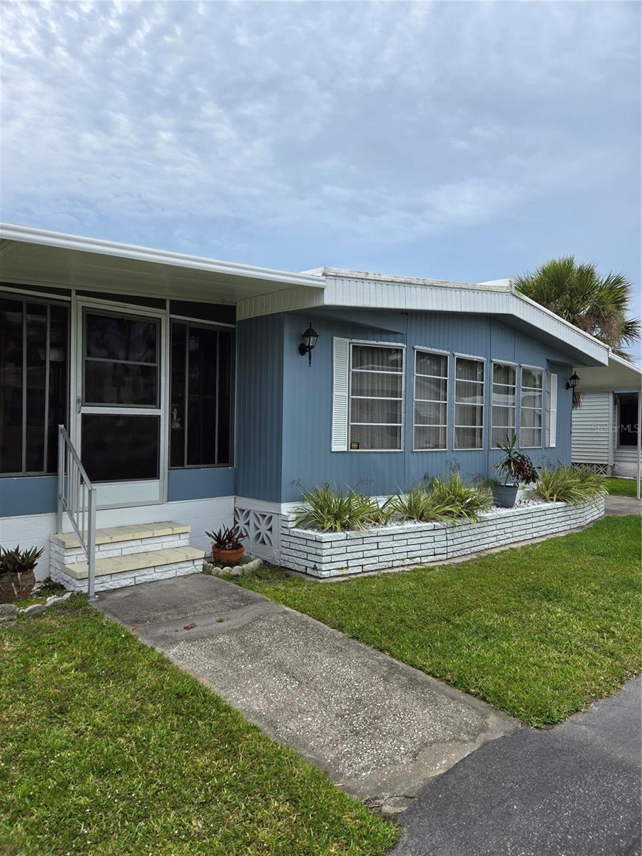 Beautiful double wide with side patio very active community has a Club house with pool, spa, shuffleboard it has cable, water, trash and yard maintenance included. it has an updated Kichen that you will enjoy entertaining your friend's, large bedroom for your retreat after enjoying with friends at the clubhouse or pool. Lovely patio to entertain. This will not last long, seller will hold note.