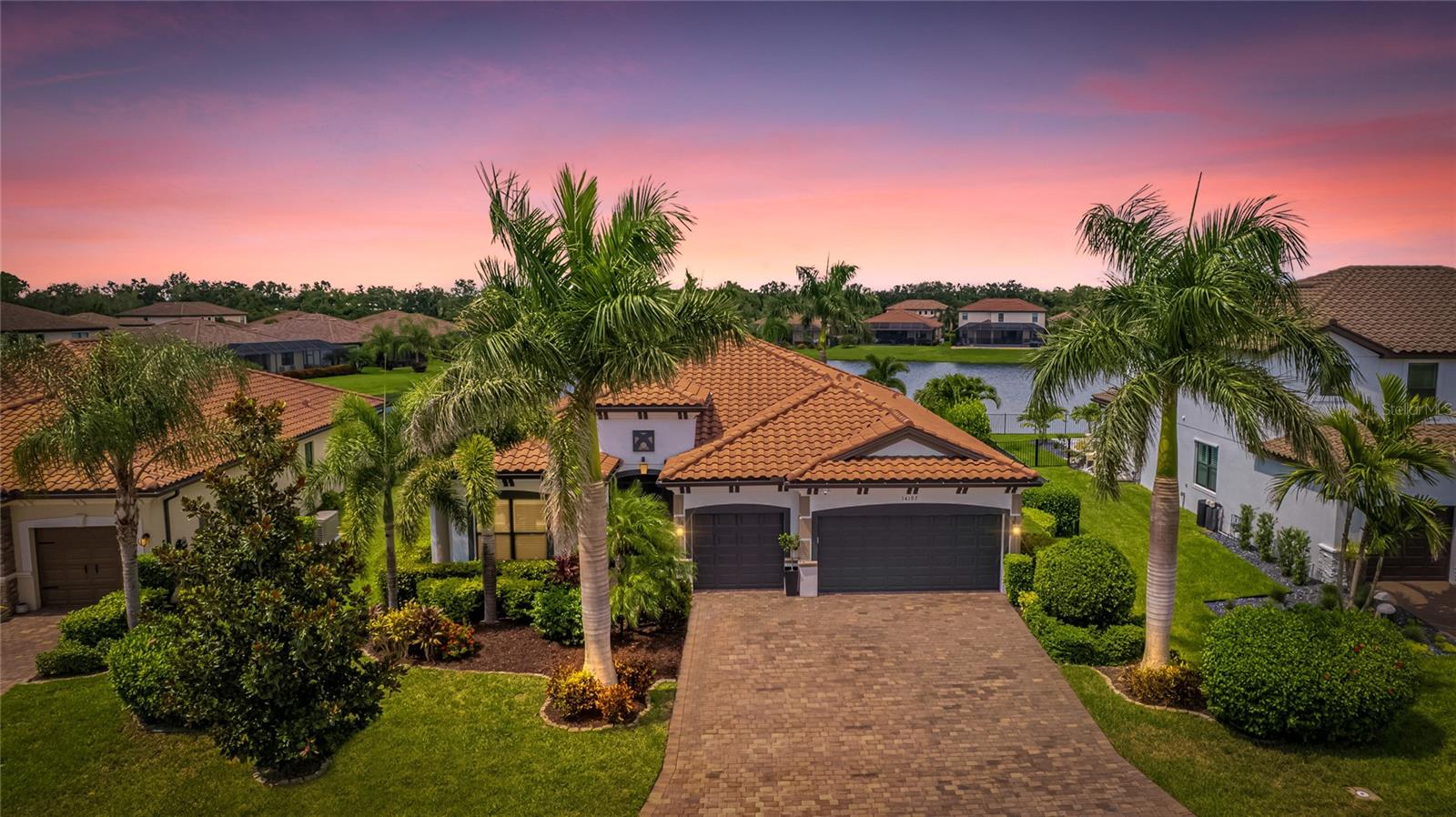 Coastal living at its finest in this beautiful and immaculately kept 3-bedroom plus den, 3-full bathroom home in the #1 award winning master planned community in the US, Lakewood Ranch. Step into this beautifully maintained and sought after Summerville II model home where luxury meets comfort in one of Lakewood Ranch's most desirable communities. Boasting a bright and airy open floor plan, this residence offers seamless flow between the living, dining, and kitchen areas—ideal for entertaining or relaxing with family. At the center of the home is the expansive kitchen, featuring premium cabinetry, upgraded stainless steel appliances, granite countertops, under cabinet lighting, and an over-sized island perfect for casual dining or gathering with guests. The Primary Suite offers a serene retreat with incredible water views, double walk-in closets, and a luxurious en-suite bathroom with dual vanities, large walk-in shower, and a garden tub. Slide open the impact glass door and you'll be drawn into your private outdoor oasis with incredible water views through the panoramic clear view screen. Enjoy family gatherings in the spacious enclosed lanai or roast marshmallows in the stone fire pit as you enjoy the sounds of the wild parrots in the trees above. The lushly landscaped fenced-in backyard has been thoughtfully upgraded to create a serene and tropical setting, complete with Royal Palms, outdoor lighting, colorful blooms, and a tranquil ambiance that feels like a personal retreat. This private lot also features no homes in front of the house showcasing a preserve and another pond view. A large den and Guest Suite with its own en-suite bathroom provide ample space for work and guests. Several additional features include spacious bedrooms, spa-like bathrooms, 3-car garage, plantation shutters, crown molding, whole house water softener, and high-end finishes throughout. Whether you're enjoying a beverage on the lanai or hosting evening get-togethers under the stars, this home is designed to impress both inside and out. Located in the highly sought after Savanna community, this home offers access to a host of amenities, including a clubhouse, fitness center, resort-style pool, playground, dog park, basketball court, and numerous walking paths. An amazing location that is just minutes to A-rated schools, fine dining, and lots of world class shopping. Lakewood Ranch offers the convenience of being centrally located to both Anna Maria Island and Siesta Key with each of their award-winning beaches!