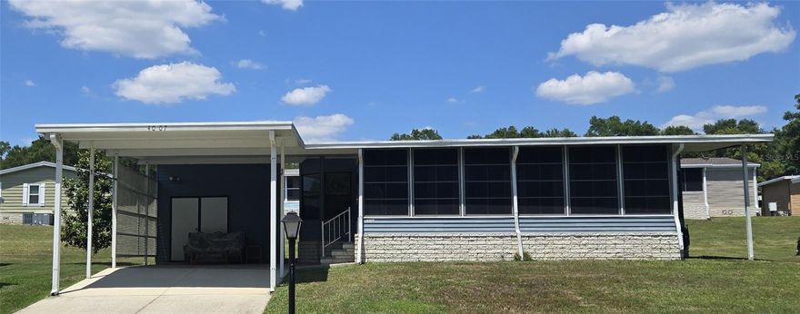 New Listing: Charming 2-bedroom, 2-bath manufactured home in Zellwood Station. This inviting home features a beautiful screened front porch that spans the length of the house, adding extra living space and offering peaceful views of the woods and green space. Inside, you'll find a versatile entry area that works well as an office, a split-bedroom layout, a full-size eat-in kitchen with a coffee bar, and a spacious living room with sliding doors that open to the patio. Furnishings negotiable. There is so much to love about this home, and it is priced to sell. Zellwood Station is a Resident Owned 55+ Golfing Community located between Apopka and Mt Dora.  We have a 72 Par golf course, 4 pools, pickleball and tennis courts; water exercise and line dancing classes and our own Whistle Stop Restaurant and Lounge with banquet facilities.  There is always something to do here.  Close to the 429 for easy access to airports and attractions, we are close to shopping, restaurants, medical facilities and churches.  Come and see what we have to offer!