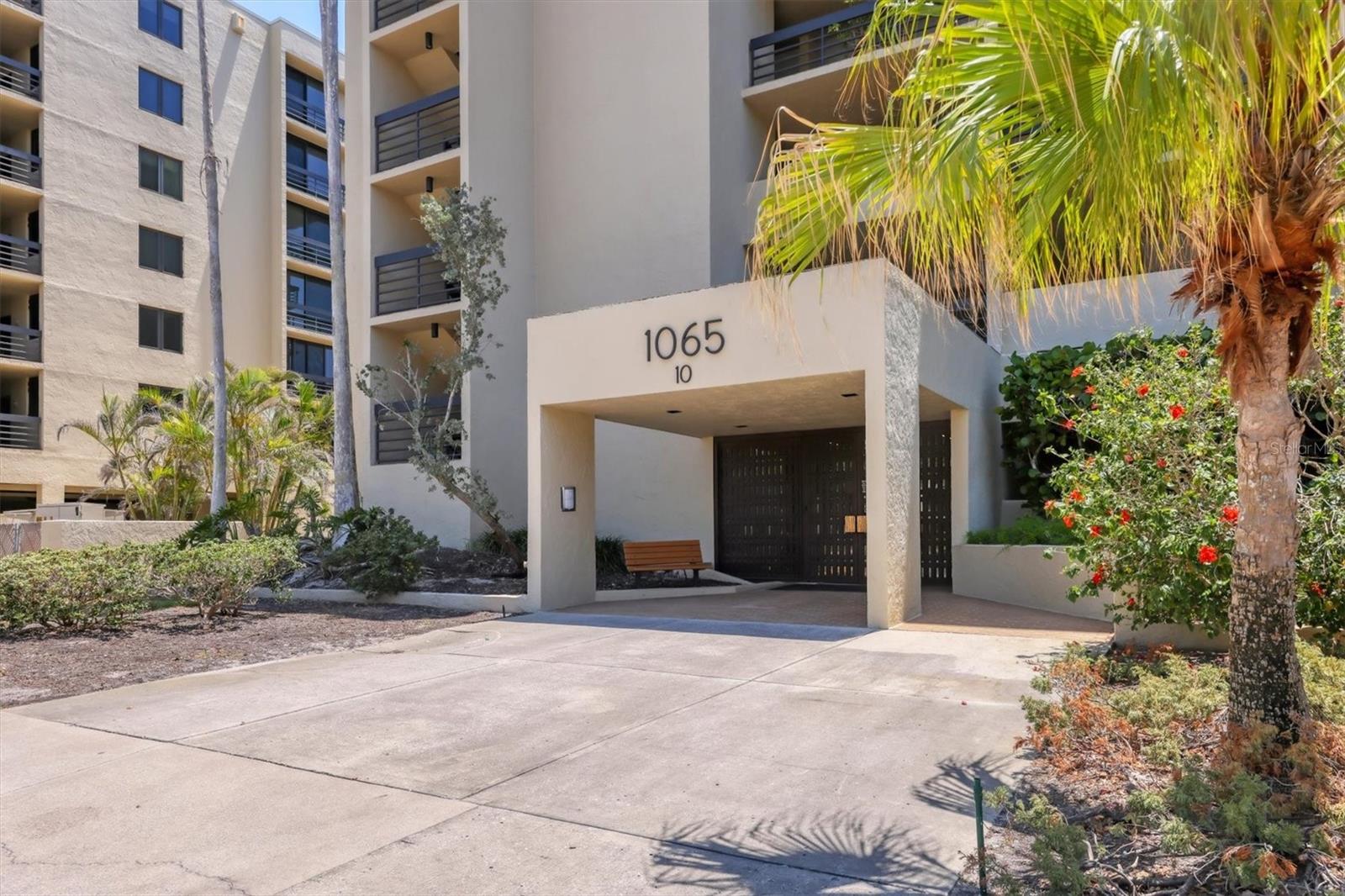 Welcome to your slice of Paradise with Southern exposure and peek-a-boo Gulf views in award-winning Beachplace! This beautifully situated 1st floor unit is overlooking Longboat Key Club Golf Course and just steps to 1,450 feet of private beach. Enjoy all-day sun, sunsets, and direct access via private stairs to the grilling area and beach walkover with chaise lounges and umbrellas. Open floor plan with NEW HURRICANE IMPACT WINDOWS INSTALLED IN 2025, A/C and hot water heater replaced in 2022, easy care tile floors in living area, updated kitchen with SS appliances, solid-surface counters, wine cooler, modern backsplash, and in-kitchen laundry. Primary suite offers walk-in shower and patio access. With two dedicated parking spaces—one covered and one uncovered—this unit offers practicality and peace of mind. Whether you're seeking a personal retreat or a savvy rental investment, this coastal gem checks all the boxes! Resort-style amenities: Jr. Olympic pool, spa, tennis/pickleball, fitness center, clubhouse, kayak storage, EV charging, 24-hr security & more. Progressive rental policy allows monthly rentals up to 12x/year. Minutes to St. Armands, downtown Sarasota, dining, golf, and airport. Enjoy the lock & leave convenience of maintenance-free living!