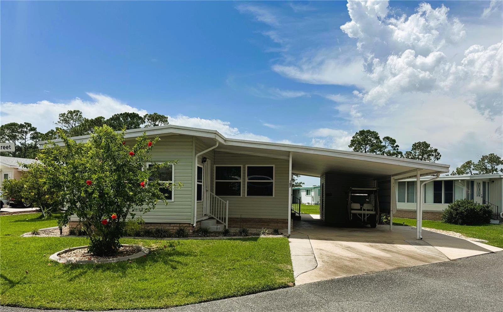 This charming two-bedroom, two-bath home is situated on a desirable corner lot along Chestnut Street and features numerous updates for comfortable living. Inside, you'll find fresh carpet, laminate flooring, and a beautifully renovated kitchen with elegant cabinetry, sleek countertops, stainless steel appliances, and a partial open floor plan that flows into the living room. Both bathrooms are equipped with walk-in showers, and the electrical panel was updated in 2020. The combined laundry room and workshop offers additional storage space, and outside, the home includes simple landscaping, an awning-covered golf cart path, and great curb appeal.
Ideally located near the community pool, clubhouse, and other amenities, this home offers both comfort and convenience. Hawthorne at Leesburg is a welcoming 55+ community in Leesburg, Florida, known for its affordable, active lifestyle. The low monthly maintenance fee of $346 includes water, sewer, lawn care, emergency services, and access to a wide array of amenities, including secure RV and boat storage.
At the heart of the community, the clubhouse serves as a vibrant social hub, offering more than 100 activities, as well as a lounge, card rooms, billiard room, fitness center, library, and fine arts room. A full-time program coordinator keeps the events calendar packed with engaging options. For those who love the water, the private marina features over 120 slips with direct access to Lake Harris, all in a secure setting.
Safety and peace of mind are prioritized, with a state-of-the-art emergency system, three dedicated emergency vehicles, and 24/7 on-site firefighter/EMTs. Homes are also equipped with emergency alarm buttons for rapid response. Surrounded by natural beauty, residents can enjoy scenic views of Lake Harris, explore nature trails, and take advantage of the community’s excellent opportunities for boating and fishing. The golf-cart-friendly layout makes it easy to get around and enjoy nearby attractions.
With amenities like a pool, fitness center, and walking trails, Hawthorne at Leesburg encourages an active, healthy lifestyle. Its convenient location near shopping, dining, golf courses, and top medical facilities makes it the ideal place to call home. Schedule your showing today and discover the exceptional lifestyle that awaits.
