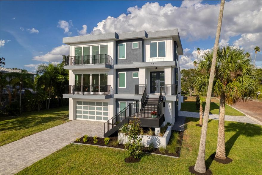 BRAND-NEW CONSTRUCTION, MID-CENTURY MODERN, ELEVATED home in DUNEDIN, FLORIDA - 400ft FROM THE GULF OF MEXICO! CHECK OUT THE VIDEO VIRTUAL TOUR. This architecturally stunning masterpiece boasts 4 bedrooms, 3.5 bathrooms, 10ft ceilings, and a sprawling 3318 sqft of contemporary living space. Set on a generous 1/3 acre corner lot in the heart of Dunedin, Florida, this home was meticulously designed to blend style, sophistication, and functionality. Drenched in natural light that glows through the LOW-E IMPACT WINDOWS, it’s light, bright, and gives you peace of mind.  The eye-catching floor is engineered HARDWOOD and there’s PORCELAIN TILE in the wet areas (no carpet).  The entire home is wired with CAT-6 network cable to ensure all of your tech needs are high-speed and reliable!
READY TO ENTERTAIN? There’s tons of space to host guests in the open-concept living room/kitchen combo, loft with a wet bar, huge balconies, and a rooftop deck! Watch gorgeous sunsets every day.  Gather outside on the 2nd floor balcony that has its own gas fireplace!
The kitchen is a chef's dream, featuring an oversized QUARTZ WATERFALL EDGE ISLAND, custom cabinets, and ALL NEW STAINLESS STEEL APPLIANCES. - including a top-of-the-line gas stove.
Cozy-up by the LED fireplace in the living room, or savor your morning coffee on one of the oversized balconies.  The attention to detail doesn't stop there!  Not only do you have quartz counters in the kitchen, but matching quartz counters in all the bathrooms and the laundry room.  Plus, say goodbye to waiting for hot water with the gas tankless water heater – efficiency at its finest!
Wrap up your day in a large master bedroom with a walk-in closet and en suite bathroom.  The master bathroom has an oversized shower with two shower heads and dual sinks.
Head upstairs to the spacious loft, complete with a WET BAR and WINE REFRIGERATOR. Also upstairs is another large bedroom with a walk-in closet and en-suite bathroom.   A few steps away are two more bedrooms joined by a full jack-and-jill bathroom with dual sinks.
But the real showstopper? Ascend to the 360-DEGREE ROOFTOP DECK for breathtaking Gulf views – it's the perfect backdrop for amazing sunsets and starry nights.
Parking is a breeze with TWO DRIVEWAYS and 6-CAR GARAGE - that can also hold multiple golf carts. But that's not all – there's ample space on the side yard for your boat, RV, or BOTH! 
All of this and only 1.5 MILES FROM DOWNTOWN DUNEDIN, where you'll find unique shops and delectable dining options.  Clearwater Beach, ranked as one of the top beaches in the world, is a mere 7 miles away.  The Pinellas Trail is only 3 blocks away.  Tampa International Airport is a brief 20-mile drive.
Showings will be available starting THURSDAY OCTOBER 12.  BOOK YOURS TODAY!