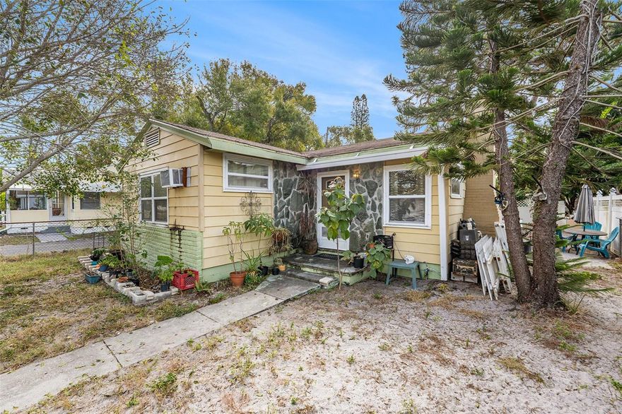 This charming property at 5224 29th Avenue South in Gulfport presents an incredible opportunity in a highly desirable, rapidly expanding area. Boasting an amazing location, this home is within walking distance of the water, local shops, and popular restaurants, capturing the essence of the "kitchy" and artistic Gulfport vibe. Enjoy the convenience of walking to the vibrant downtown Gulfport district with its unique shops, restaurants, and year-round Tuesday Morning Market, with the beautiful Gulfport waterfront and beach just minutes away. The property features a key highlight with the potential offered by the garage conversion into additional living space, currently used as a detached bedroom, studio, or private office, which adds versatility to the existing 2-bedroom, 1-bathroom floor plan. This home offers lots of potential for investors or developers looking to upgrade the 1,172 sq. ft. of living space, providing a solid starting point with good electrical and plumbing systems and a location on a wide brick street in a non-flood zone. The exterior is just as appealing, sitting on a 5,183 sq. ft. lot and featuring a covered front porch and a low-maintenance backyard with pavers and gardens, perfect for Florida-style entertaining. This property is an ideal find for those seeking a home in a friendly, walkable community with ample opportunity to customize and create their dream Gulfport oasis. For more information or to schedule a private viewing, please contact the listing agent directly.