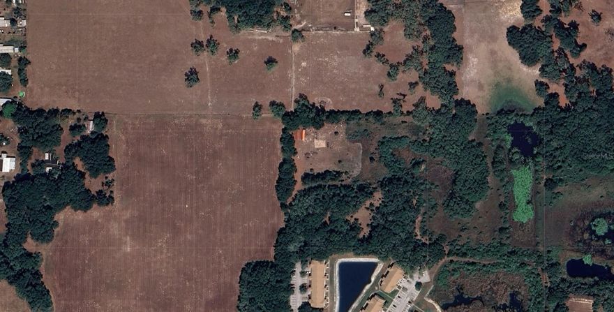 This 2.73-acre vacant lot in a peaceful residential area of Dade City, Florida, offers endless potential with no HOA and no need for appointments—just drive by and see it for yourself. It is zoned for any type of home, making it ideal for building a custom dream home or placing mobile homes. Investors will love the opportunity to subdivide it into two separate lots for resale or rental, maximizing income potential. Located close to scenic nature parks and outdoor activities, this is a rare find with flexibility, freedom, and value—perfect for development, income generation, or building your dream retreat. To access, enter through apartment complex (gates open from 9-5pm) or sidewalk gate (open 24/7). New owners have to request access to the apartment's administration.
