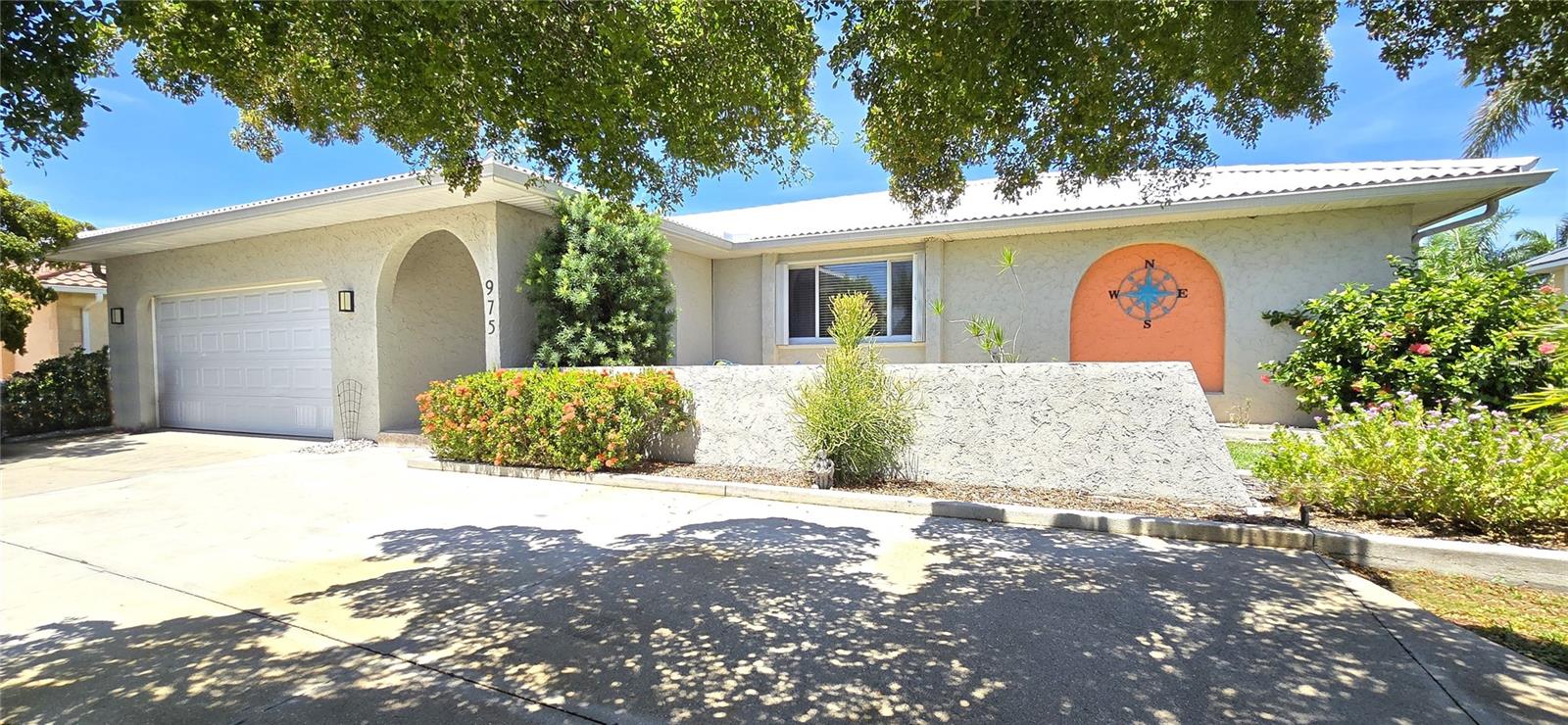 **PLEASE ENJOY THE 3D INTERACTIVE VIRTUAL TOUR ASSOCIATED WITH THIS LISTING – Welcome home to Punta Gorda, Florida! This three-bedroom, two-full-bath home was built in 1978 and is situated on a navigable canal in the sought-after waterfront community of Punta Gorda Isles. It is being sold fully furnished with a tasteful neutral decor, split bedroom design and ceramic tile flooring throughout, making it move-in ready! The home features full window storm protection, a two-car attached garage, a circle driveway and an enclosed flex room off the spacious rear lanai which is accessible from the dining area and primary bedroom. The waterfront includes 80 feet of city-maintained seawall, a 16’ x 10’ concrete dock and electrical service, providing easy access to the open waters of Charlotte Harbor. The property is conveniently located just .3 miles from restaurants, two miles from the Fisherman’s Village complex, three miles from historic downtown Punta Gorda and just 10 minutes from Punta Gorda Airport (PGD) offering 50+ direct flights on Allegiant Air. This home is ideal for full-time or seasonal residency or as part of the VBRO network. Schedule your private showing today or take a virtual tour by clicking on the attached interactive 3D Virtual Tour!