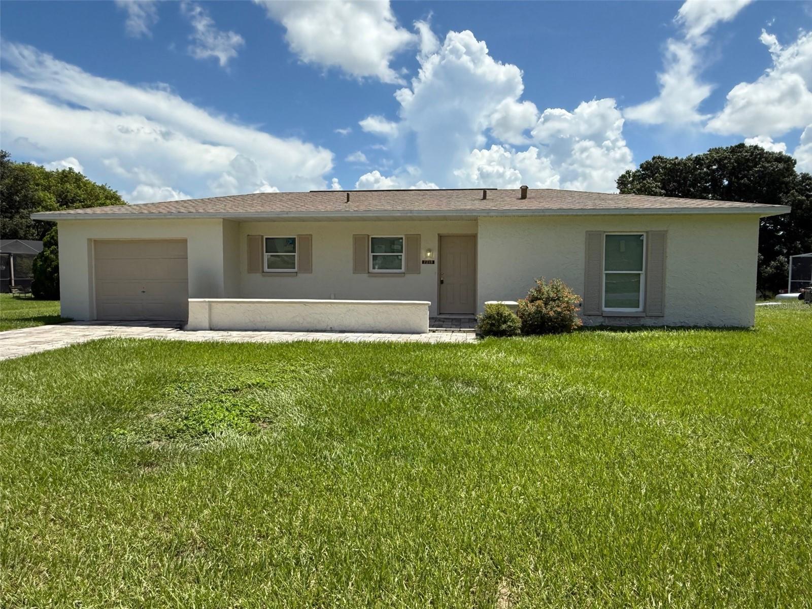 **OWNER FINANCING AVAILABLE WITH QUALIFIED DOWN PAYMENT** Charming 3/2 on beautiful Holiday Lake offering scenic views right from your backyard (not in a flood zone). The interior has been updated with light and bright kitchen cabinets and counter tops, newer flooring, new light fixtures, and fresh paint. The windows are also newer!, which will help keep the utility bills low! The bedrooms are spacious including a primary suite with a private bathroom and walk-in closet. The living room has two sets of sliding glass doors leading to the large screened lanai where you can relax and enjoy the tranquil mornings and evenings. Public records indicate the HVAC was replaced in 2017. This property has a repaired sinkhole. Call today before it's too late!