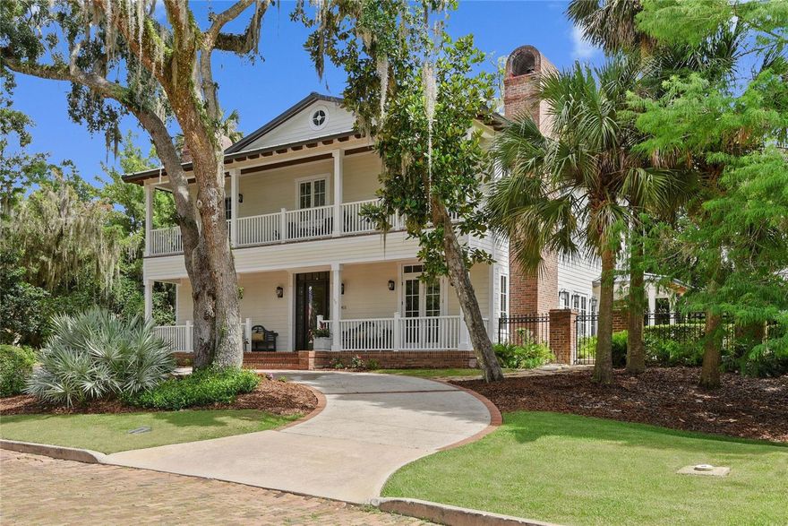 Under contract-accepting backup offers. The best of all worlds! Custom built, low-country style pool home with Lake Osceola views and chain of lakes access. Oversized lot- .33 acres and 122 feet curbside. Premier, dead-end street with only 3 neighbors. Perched atop a hill, sits this gracious 5 bedroom plus bonus, 5 bath home with a welcoming circular driveway. Cannot beat this floorplan- no wasted space. The formal living room off the bright 2 story foyer provides sophistication with a wood-burning fireplace, new carpentry, tray ceiling, contemporary lighting and French doors leading to the covered porch. A formal dining room allows for seamless entertaining featuring beautiful builts-ins. Spectacular chef’s kitchen (Skolfield Homes 2016) offers marble counters, stainless steel appliances (Miele, Wolf, Subzero), gas range with hood, built in double oven, an oversized island, and open eating space. Adjacent to the kitchen is the Family Room, with an abundance of windows and French doors, all overlooking the beautiful pool and brick patio. Downstairs in- law suite with private bath, coffered ceilings and fireplace. Upstairs you will find the primary retreat with access to second floor balcony and a relaxing all new master bath (Skolfield 2023) complete with dual sinks, glass shower, soaking tub and spacious walk-in closet. 3 additional oversized, designer bedrooms and 2 full baths complete the upstairs. Wood floors, crown molding, top-of-the-line finishes can be found throughout this stunning home. Private backyard offers several amenities including covered patio with summer kitchen and a shellstone pool perfect for those hot Florida summer days. ACs (Trane, Nexia) replaced 2019. Rinnai gas water heater 2022. All new interior paint, wallpaper in dining, office, powder bathroom, primary bathroom, guest bedroom. Interiors completed by Steele Street Designs. Surrounded by multi-million dollar homes. Winter Park Chain consists of six lakes connected by navigable canals. Lake access directly across the street. Fishing public dock area to launch paddleboards, canoes and kayaks. Long driveway and roundabout is perfect for guests, multiple cars and parking. Ample storage spaces- understairs closet, mud room, large hallway closet upstairs, attic and garage storage. This home cannot be missed! Improvements list available upon request. Furniture can be purchased with house.