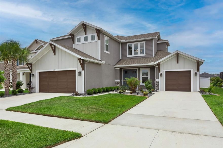 LOVE WHERE YOU LIVE STARTS HERE! Welcome to 7274 Talamore Drive. Built in 2022, this stunning well maintained 5 bedrooms| 4.5 baths| 3-car split garage + media room residence is located in the GATED SUBDIVISION of Talamore inside of the highly desired WaterGrass Community! Built by The Award Winning Taylor Morrison, this immaculate popular Tortola floor plan features 3461 square feet of thoughtfully designed modern living space and is positioned on an EXQUISITE fully fenced in .186 acre lot with breathtaking water views. The perfectly manicured lawn, upgraded elevation with neutral earth tone stone and elegant, hinged double doors set the tone for this bright open floor plan with a grand 2 story foyer. Just off the entryway is a private fifth bedroom complete with its own full bath- ideal for guests or extended family, a half bathroom and the laundry room. At the heart of the home, the spacious gathering room flows seamlessly into a extended screened-in covered lanai through oversized pocket sliding glass doors, creating the perfect blend of indoor and outdoor living with peaceful water views. Overlooking this central space is the gourmet kitchen with an elongated island with quartz countertops, stainless steel appliances, walk in pantry, additional built in wall cabinets with a sink, beautiful tile flooring in all open 1st floor living areas and upgraded 8ft doors. Adjacent to the kitchen, the dining area offers a warm and welcoming space for family meals and entertaining. The primary suite, located on the main floor, offers a peaceful retreat with a spa-inspired bathroom featuring dual vanities, oversized soaking tub, huge flow through shower with dual shower heads, a private water closet, and an expansive walk-in closet. Upstairs, three additional bedrooms provide comfort and privacy—Bedroom 2 includes its own en-suite bath and walk-in closet, while Bedrooms 3 and 4 share a full bathroom with double sinks and each feature walk-in closets. Just in time for baseball season, the large theatre room brings it all together with a full dedicated home entertaining station perfect for entertaining. The Tortola is more than a home—it’s a lifestyle built for connection, comfort, and enjoyment. Watergrass offers many amenities including an on-site elementary, exclusive community clubhouse, 14 parks and/or neighborhood playgrounds, tennis and basketball courts, resort & Olympic-style pools, large & small dog parks, and walking trails! This home is in an ideal location, 7 minutes from Epperson Lagoon, 10 minutes from I-75, 15-20 mins from shopping, entertainment, restaurants and all that Wesley Chapel provides! Don't miss this rare opportunity to own this highly desired floor plan in this thriving area of Wesley Chapel!