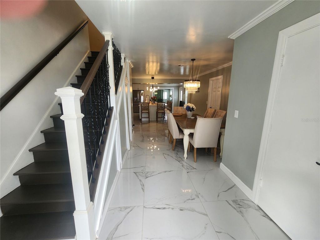 Photo of 7715 W Pocahontas Avenue, Tampa, FL 33615 (MLS # TB8425359)