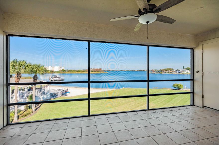 One or more photo(s) has been virtually staged. Welcome to Fairview Vista!  This quiet condminium community, tucked away on the shores of beautiful Lake Fairview, is one of Orlando's best-kept secrets!  Located on the third floor, unit #309 is move-in ready and LOADED WITH BRAND-NEW UPDATES througout.  Luxury vinyl flooring flows through the living/dining area, kitchen, and both bedrooms.  The kitchen features new cabinets and countertops, as well as all new GE appliances with a 2-year warranty!  The spacious living/dining area is enhanced with a vaulted ceiling and new electric fireplace with remote control.  Sliding doors lead to the screened balcony, with tile flooring and a spectacular lake view.  Also on the balcony is a laundry closet with brand-new, full-capacity GE washer and dryer, as well as a large storage closet.  The primary bedroom features a vaulted ceiling, balcony access, a walk-in closet, and an ensuite bathroom where you will find a oversized vanity, new shower and toilet, and new ceramic tile flooring.  The second bedroom and hall bathroom have also been updated, and the hot water heater is new.  BONUS: The monthly condo fee includes 1G high-speed internet, over 500 cable channels, and cloud DVR!  The unit is conveniently located just a few steps from the building elevator, and has an assigned carport.  Residents of Fairview Vista enjoy a variety of amenities, including a sparking pool and a lakeside deck and pavillion, which offers complimentary use of a gas grill and access to the white sand beach.  The Clubhouse is available to rent for parties and entertaining, and the community offers a sport court for tennis and pickleball.  Boating enthusiasts will appreciate the private boat ramp, along with a secure storage area for boats, jetskis, and trailers, and boat dock (monthly fee applies).  Fairview Vista is convenient to Downtown Orlando and just minutes from College Park and the up-and-coming Packing District.  The association is financially sound and in compliance with all Florida condominium statutes, providing owners with peace of mind.  Contact your Realtor or the listing agent to arrange your private showing!