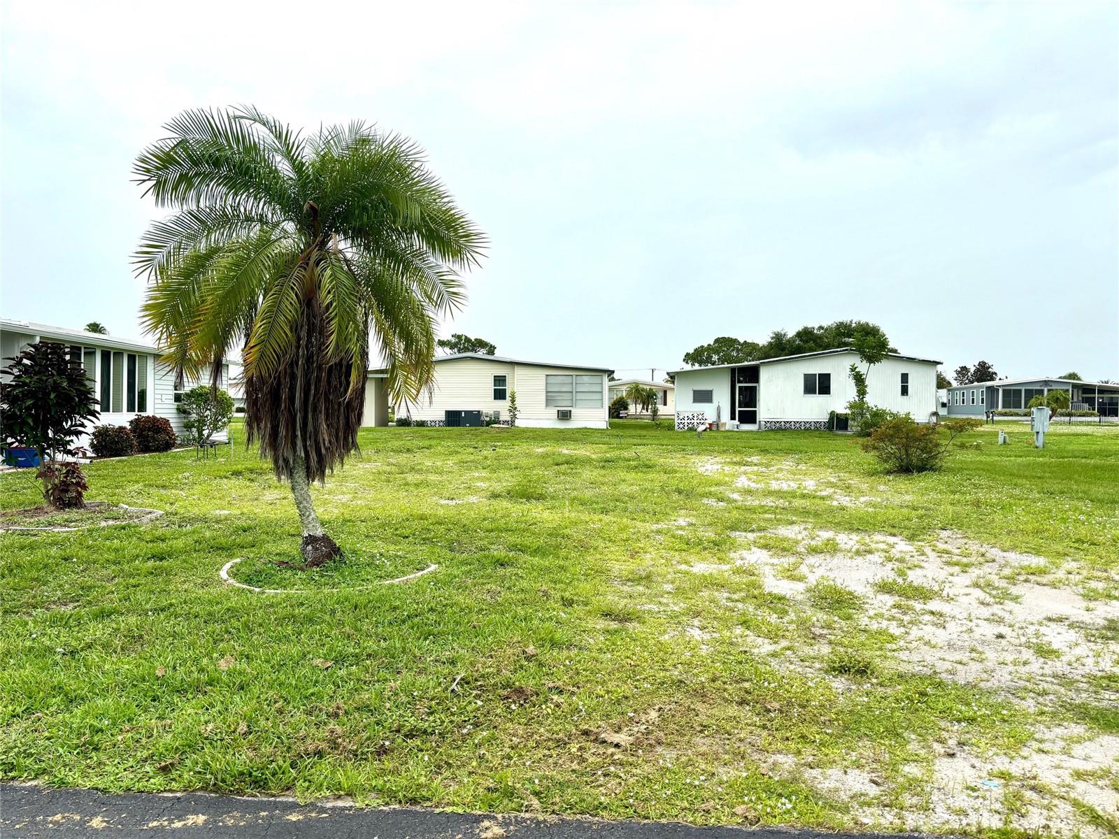 Vacant lot with a view of one of our 8 beautiful lakes. La Casa, a vibrant 55+ community, offers the ultimate Florida lifestyle. We have 974 homes nestled among a variety of native trees with spacious common grounds surrounding our eight lakes. Located between Sarasota and Fort Myers, this is a boater's dream with access to the Gulf of Mexico. It is convenient for shopping, sightseeing, golfing, fishing, and boating, as well as all the culture and elegance the Southwest Florida area is noted for. La Casa may have the best pools in the area. Our crown jewel is an extremely large, 40 X 60-foot swimming pool that is kept at a perfect 87 degrees. Our smaller 20 x 40 pool is quietly nestled between the clubhouse and the Activity Building. Both pools have adjacent hot tubs which are ideal for soaking muscles that are tired from golfing or tennis. Wireless Internet (Wi-Fi) is available at the Clubhouse, Activity Building, and Recreation Hall area where these pools & spas are located, so you can catch some rays while you catch up on your email! Sound enticing? Come for a visit to this self-contained oasis and see for yourself why La Casa is the ultimate destination for both snowbirds and year-round residents!