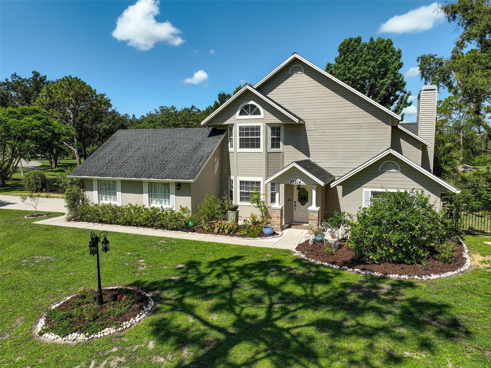 Welcome to this absolutely stunning Mill Creek retreat, perfectly positioned on a spacious 1-acre corner lot with serene pond views! This beautifully upgraded two-story pool home has been landscaped to attract birdlife and is truly a sanctuary both inside and out. Relax in this peaceful setting complete with a screened-in lanai overlooking your private pool, or unwind beneath the oversized retractable awning. Practice your golf game on your very own putting green, then rinse off in the private cabana-style pool shower.
Inside, no detail has been overlooked—from gleaming hardwood floors and a custom wood-burning fireplace to marble countertops, stainless steel appliances, wine fridge, and soft-close cabinetry. The open-concept design features soaring ceilings and thoughtful finishes throughout. Upstairs, the private primary suite includes dual walk-in closets and a luxurious ensuite bath with a massive walk-in shower and dual vanities. Enjoy full automation capabilities with the app controlled front door, garage door, washer, dryer, thermostat and ring doorbell. The alarm system monitors all windows and doors and includes motion detector sensors, 4 exterior cameras and an interior camera. The refrigerator door has a Krupps coffee maker attachment and the primary bath shower head has a Bluetooth speaker!
Bonus features include a charming storage shed that can provide additional storage or be converted to a workshop, a reverse osmosis system, newer roof (2017), dual A/C units (2017), 2 water heaters (2019), new gutters, shutters, and irrigation. The fully fenced yard offers peace and privacy with no rear neighbors, a side-entry garage, and plenty of parking—including room for an RV, boat or potential outbuilding!
Located in the highly sought-after community of Mill Creek that offers large lot properties and architectural diversity so lacking in today's new communities, with easy access to I-75, top-rated beaches, airports, dining, and more—this one truly has it all!