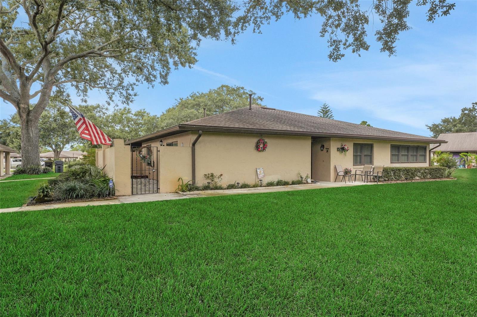 MAINTENANCE FREE SPACIOUS GOLF VILLA - END UNIT WITH 2 BEDROOMS & 2 BATHS, LOCATED IN THE GATED & MANNED GOLF COMMUNITY OF CYPRESSWOOD GOLF & COUNTRY CLUB!!! 18-hole golf course, Pro shop, pool, tennis, fishing, wellness center, clubhouse, restaurant, pub and activities for an active lifestyle! The open floor plan features living room open to dining and enclosed family room with access to the laundry room, oversized primary suite with double closets, and handicap accessible step-in shower, a spacious guest room with walk-in closet, guest bathtub & shower and vanity with storage. You'll enjoy the 28x8 courtyard on the front of the home with privacy gate providing access to the carport & mailbox. Carport has guest parking. Newer windows, appliances, A/C and roof. Home has been well maintained, pet & smoke free. HOA fees are $280 monthly, which includes lawn care, landscaping, mature tree trimming, irrigation, exterior power washing, exterior paint, gutter & downspout as well as roof maintenance. Cypresswood has close proximity to LEGOLAND, Winter Haven, Lake Wales, Orlando, Tampa, mid-Florida attractions, Disney, Epcot & Universal. Call today to see this affordable home & make it your own!!!