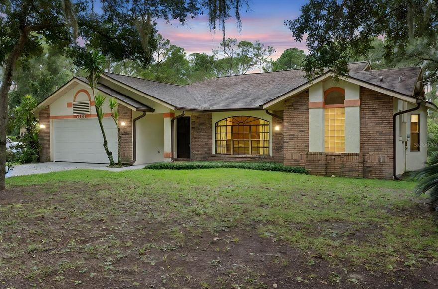 One or more photo(s) has been virtually staged. This rural 3/2 home on .6 acre in north Deland is just a short hop to Historic Downtown Deland, I-4, and Daytona Beach. This split floor plan home features two separate living areas, one that features an abundance of natural lighting, a wood-burning fireplace and leads to the 21’ X 12’ screened rear lanai and the huge back yard with shed. The kitchen is centrally located and includes all appliances. The Primary Bedroom Suite includes a walk-in closet, and the ensuite bath includes a walk-in shower and garden soaking tub. There is NO HOA here, so make this home the dream home that suits YOUR needs. This home includes solid “bones”, including a brand-new electrical panel in 2025. Ask your Realtor® for the unbranded virtual walking tour. All measurements are approximate and should be independently verified.