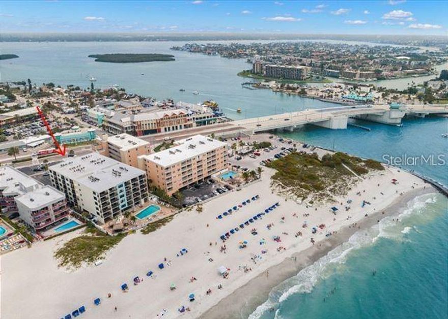 INVESTOR DREAM PROPERTY - PERFECT INCOME-PRODUCING MADEIRA BEACH BEACHFRONT CONDO | This amazing 2 bed 2 bath unit right on the sandy beaches of Madeira Beach is very unique and rare with no restrictions on the number of rentals and nightly rentals allowed and UNLIMITED owner use****ONLY 3 NIGHT MINIMUM**** ALL AGES, ANIMAL FRIENDLY***Welcome home to your piece of paradise which is in the absolute most perfectly positioned Top Floor Condo across the street from famous John's Pass full of shopping, dining, boat rentals and waterfront options to enjoy. This residence is positioned on Madeira Beach, and the Gulf of America. This condo is steps to being on one of Florida’s most beautiful beaches, Madeira Beach, while also located just across Gulf Blvd from the world famous Johns Pass Village & Boardwalk featuring many shops, restaurants, water activities, & dolphin watching. A perfect location! This is a very popular vacation rental building allowing short term rentals while still allowing you to use it personally at your convenience or you can make this your full-time home  and provides you and your guests with unlimited access to the best sunsets available on this coast.. 2 spacious bedrooms and 2 bathrooms including a grand master suite with an en-suite bath enjoying a time at the beach that is undeniably memorable. While you are not able to leverage time at the beach, this building allows for short-term rentals (min 3 days) for your cash flow desires. Fully walkable to so much so your guests don't need a car which makes for ease and low-cost, convenient travel. Fully turnkey solutions are available for rentals so please ensure you inquire about this at your showing. Schedule your showing today and spend the winter months enjoying the sun and sand of beautiful Madeira Beach! Condo building features over $2 million in professionally engineered structural and common are element updates over the past five years including concrete, rebar, balconies, hallways, roof, pool heater and pool filtration system replaced, building generator replaced, repaved parking lots, pool recently resurfaced, pool bathroom upgrade, fencing around pool & bike storage, new emergency building generator, & much more.  Seller's portion of special assessment paid in full.