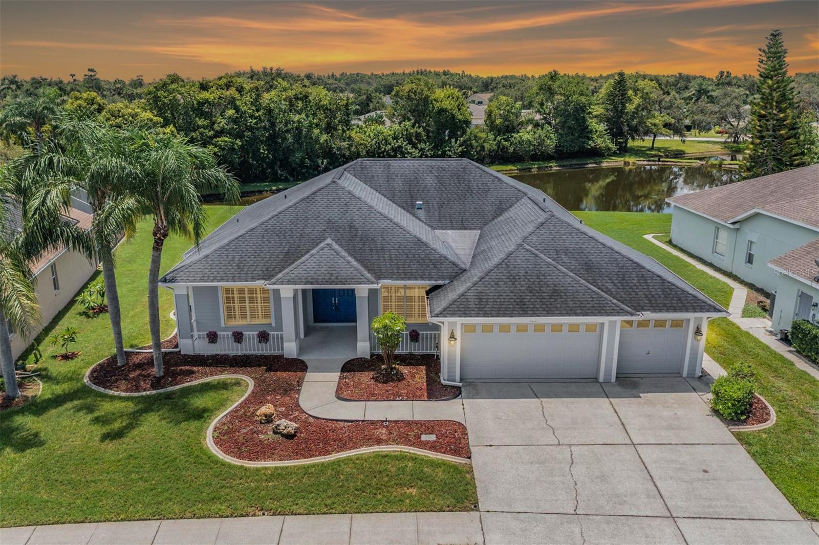 Welcome to Your Dream Home in Trinity Oaks! Tucked away on a quiet cul-de-sac in the highly sought-after Trinity Oaks community—with no CDD fees and low HOA—this beautiful pool home offers the perfect blend of comfort, function, and Florida charm. Ideally situated on a gorgeous pond-view lot, you’ll enjoy peaceful mornings and serene evenings from your screened-in lanai and sparkling pool—a true backyard oasis. Step inside to an open and airy floor plan, starting with a welcoming entry foyer that flows effortlessly into the expansive great room—ideal for gathering with friends and family. The kitchen is a cook’s dream, featuring stainless steel appliances, generous counter and cabinet space, and a sun-filled breakfast nook that overlooks the pool and pond. For those who love to entertain, a dining area provides the perfect setting for dinner parties or holiday meals. The primary suite is a private retreat, large enough to include a cozy reading nook, with sliding glass doors that open directly to the lanai. The en suite bathroom boasts a corner soaking tub, step-in shower, private water closet, and dual vanities. A flex room offers endless possibilities—create a home office, fourth bedroom, or media room—whatever fits your lifestyle. The secondary bedrooms are generously sized, offering comfort and versatility for guests or growing families. Additional highlights include a walk-in laundry room with utility sink and natural light, plus a spacious three-car garage—a rare find that offers plenty of storage and was re-roofed in 2018. Located in the heart of Trinity, you're just minutes from top-rated schools, shopping, dining, parks, and more. This home checks every box—location, layout, views, and value—so don’t wait. Schedule your private tour today and make Trinity Oaks your new address!