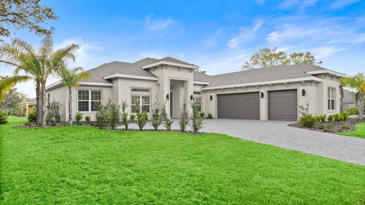 Welcome to The Sanctuary, a gated island neighborhood, just off the Intracoastal Waterway in Palm Coast, Florida. This newly built (2023) home offers 2658 square feet of luxury living with four bedrooms, three baths and an office. Concrete block construction, featuring a Chefs kitchen with stainless appliances, 36" gas range, and a built-in coffee bar with nook. Tray ceilings, 8' doors, his and hers walk-in closets, a large double rain shower and tub in master. Imported Italian tile with carpet in the bedrooms. The oversized three car garage includes a loft above with unbelievable storage and an EV Charging Station. Priced to sell at $949,000. Call to see it today. Living in The Sanctuary means you can have a quiet home in a waterfront gated community, yet still have easy access to everything Palm Coast has to offer. Although it provides residents with a feeling of quiet seclusion, The Sanctuary is actually centrally located in Palm Coast, yet only accessible by one gate or the water. The Sanctuary features pristine lakes and trails that wind through majestic old oak trees. Call and and view it today before it's gone.
