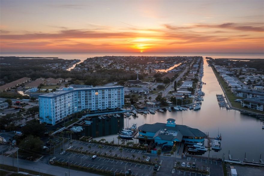 Come Live the Easy Florida Waterfront Lifestyle! ????
Step into this beautifully updated, warm, and tropical 2-bedroom, 2-bath waterfront condo featuring your very own deeded dock just steps from your back door! Located in the desirable Sea Castle Condo Tower, this light and bright split-plan residence offers spectacular views of the marina and open water, along with a spacious, flowing floor plan that feels both open and inviting. The modern kitchen is designed for both style and function, boasting Corian countertops, soft-close cabinets, and tons of storage, with all new appliances installed within the past two years. The adjoining living and dining areas blend seamlessly together, perfect for entertaining or simply relaxing while taking in the stunning water views. The primary suite is a peaceful retreat with expansive waterfront views, generous closet space, and a renovated ensuite bath featuring an updated vanity and walk-in shower. The guest bedroom is spacious and welcoming, with a nearby updated guest bath for added convenience.  This unit comes with a highly coveted private dock slip!

Sea Castle has recently undergone extensive upgrades throughout, including:
All-new elevated pool equipment and oversized heated pool
New BBQ grills, large gazebo, fishing dock, and marina access
Two community boat ramps
Refreshed workshop, shuffleboard courts, and library
Brand-new wiring and laundry facilities on every floor
New fiberglass storage doors for each unit
RV and boat trailer parking conveniently located behind the pool

Your monthly condo fee covers all exterior maintenance, pest control, roof, water, sewer, trash removal, basic cable TV, internet, and master/flood insurance—giving you true maintenance-free living!

For an added touch of paradise, you can also join Gulf Harbors’ private sandy beach on the Gulf of Mexico—just $200 a year—offering breathtaking views of Anclote Key and endless sunsets. Located just minutes from vibrant downtown New Port Richey, you’ll enjoy local dining, shopping, bars, and community events at Sims Park. Close to everything you need—shopping, medical, Tampa Airport, and more—this condo is perfect for year-round living or a relaxing Florida getaway.
This is coastal living at its finest—where every day feels like vacation.