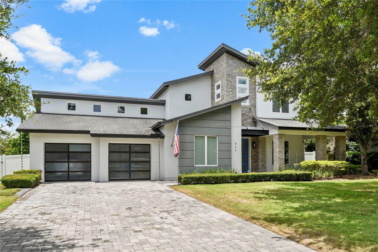 Discover luxurious living in the heart of Winter Park! Crafted with exquisite attention to detail, this 5-bedroom, 4.5-bathroom pool residence showcases absolute perfection and modern elegance. Built in 2018 by David Weekley Homes, the property boasts a captivating stone façade and a private backyard oasis featuring a saltwater, heated pool and spa with water feature, and ambient lighting — an entertainer’s dream.
Inside, soaring ceilings, gleaming wood floors, expansive picture windows, and an abundance of natural light create an inviting and sophisticated atmosphere. The gourmet kitchen is a chef’s paradise, with white maple cabinetry, Quartz countertops, a breakfast island, and stainless-steel gas appliances. The open floor plan seamlessly connects the kitchen, great room, and outdoor living spaces, perfect for hosting friends and family.
Located on the first-floor, the spacious primary suite includes a spa-inspired bathroom, while a dedicated home office and guest suite offer comfort and versatility. Upstairs, discover three additional bedrooms, two full bathrooms, and a versatile loft space. Step outside to the wrap-around porch overlooking meticulously landscaped gardens, creating a serene and private outdoor retreat.
Located just minutes from Park Avenue, Rollins College, and Advent Health Winter Park, this exceptional residence offers convenient access to top shopping, dining, and cultural attractions. Zoned for the highly sought-after Brookshire School District, this is your chance to experience elevated living in one of Winter Park’s most coveted neighborhoods. Schedule your private showing today and make this exquisite property your new home.