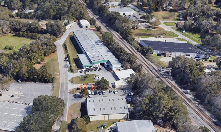 38,480 SF Flex Industrial Warehouse. The property is zoned M-1 (light industrial) and sits on 3.33 acres. The building was built in 1999 and expanded in 2001. The building consists of 2725 SF (+/-) of air-conditioned office area with offices, break room, and restrooms. The warehouse area is fire suppressed, has 3 phase power, LED lighting, 19’ clear height, 25’ column spacing, with both grade level access and a functional truck well with loading docks. Additionally there is a 4,000S SF metal building and several additional structure for covered outdoor storage. The site is also fully fenced and gated for security. The property is in NE Ocala with provides easy access to US Highway 27/301/441 as well as linkage to I-75 via US 27 for efficient distribution.