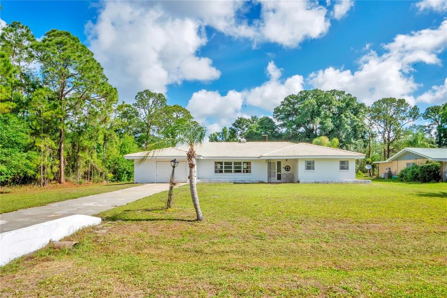 Step back in time and discover a true Mid-Century Modern gem in the gated community of Indian Lake Estates. Built in 1961 and lovingly preserved, this 4 bedroom, 2 bath home offers 2,281 square feet of retro charm on a spacious ½-acre lot with no rear neighbors and woods along one side for added privacy. From the moment you enter, the home feels like a beautifully maintained time capsule, showcasing original terrazzo flooring, pristine vintage bathrooms with mint-condition tile, and authentic architectural details rarely found today. The kitchen is a standout centerpiece featuring stunning turquoise Formica countertops, real wood cabinetry with roll-out drawers and dividers, and an iconic Frigidaire Flair slide-out range with double side-by-side ovens that perfectly captures the era’s style and innovation. The spectacular Florida Room features original broken-tile mosaic flooring and offers the perfect space to relax, entertain, or simply enjoy the home’s nostalgic character. Modern updates include a well pump replaced in 2024 and water heater in 2021, while the private well and septic, durable tile roof, and attached 1-car garage add convenience and functionality. Beyond the home itself, Indian Lake Estates spans more than 7,500 acres with over 700 homesites of ½ acre or larger and offers an incredible lineup of amenities including golf, tennis, pickleball, basketball courts, playgrounds, a marina, community boat launch, beach, covered picnic area, clubhouse with restaurant and bar, fitness center, game room, library, ballroom, and an optional 18-hole golf course membership. Residents also enjoy golf cart rentals, a café, churches, post office, and the community’s famous 1,000-foot fishing pier on Lake Weohyakapka — the largest freshwater fishing pier in the state of Florida. Conveniently located just 17 miles southeast of Lake Wales and 15 miles east of Frostproof, this one-of-a-kind property offers the perfect blend of vintage style, peaceful surroundings, and resort-style living.