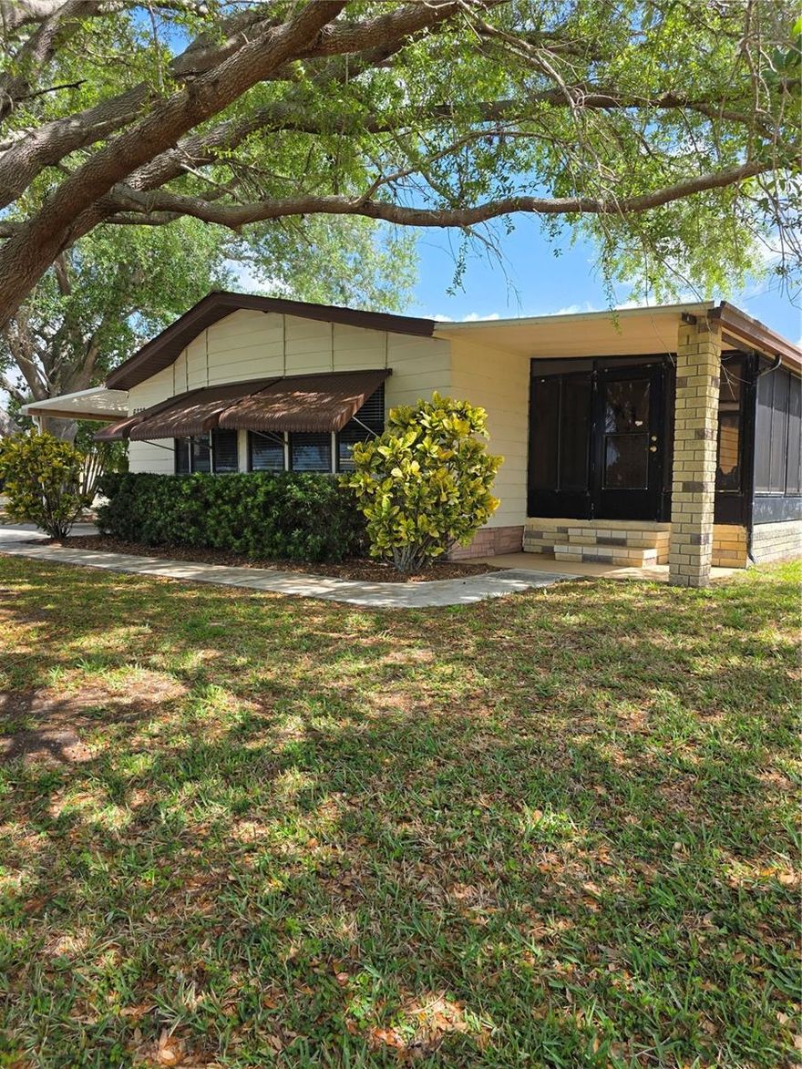 Welcome to easy Florida living in the desirable 55+ community of Lemon Bay Isles! This charming 2-bedroom, 2-bath home offers 1,352 square feet of comfortable living space and comes fully furnished, making it truly move-in ready.

Step inside to find luxury vinyl flooring throughout and a spacious, open layout perfect for both everyday living and entertaining. The home features a large dining area with a breakfast bar, plus a versatile office/desk space just off the living room—ideal for hobbies or working from home.

The primary suite is a standout, offering two generous walk-in closets and a private full bath. Enjoy Florida’s beautiful weather year-round in the enclosed lanai with screened windows, allowing for refreshing breezes and additional living space.

Situated on a large lot with mature trees, this property also includes a paved carport and a convenient storage room with washer, dryer, and utility sink. Located in Flood Zone X500 for added peace of mind.

Residents have the option to enjoy the nearby Edgewater Club for a low annual fee, featuring a community pool, pickleball, shuffleboard, bocce, and a variety of social activities. This golf cart community neighborhood is perfect for enjoying the Florida lifestyle.

Ideally located just minutes from the stunning beaches of Manasota Key and the charm of Dearborn Street with its shops, dining, and local events—this is coastal living at its best!