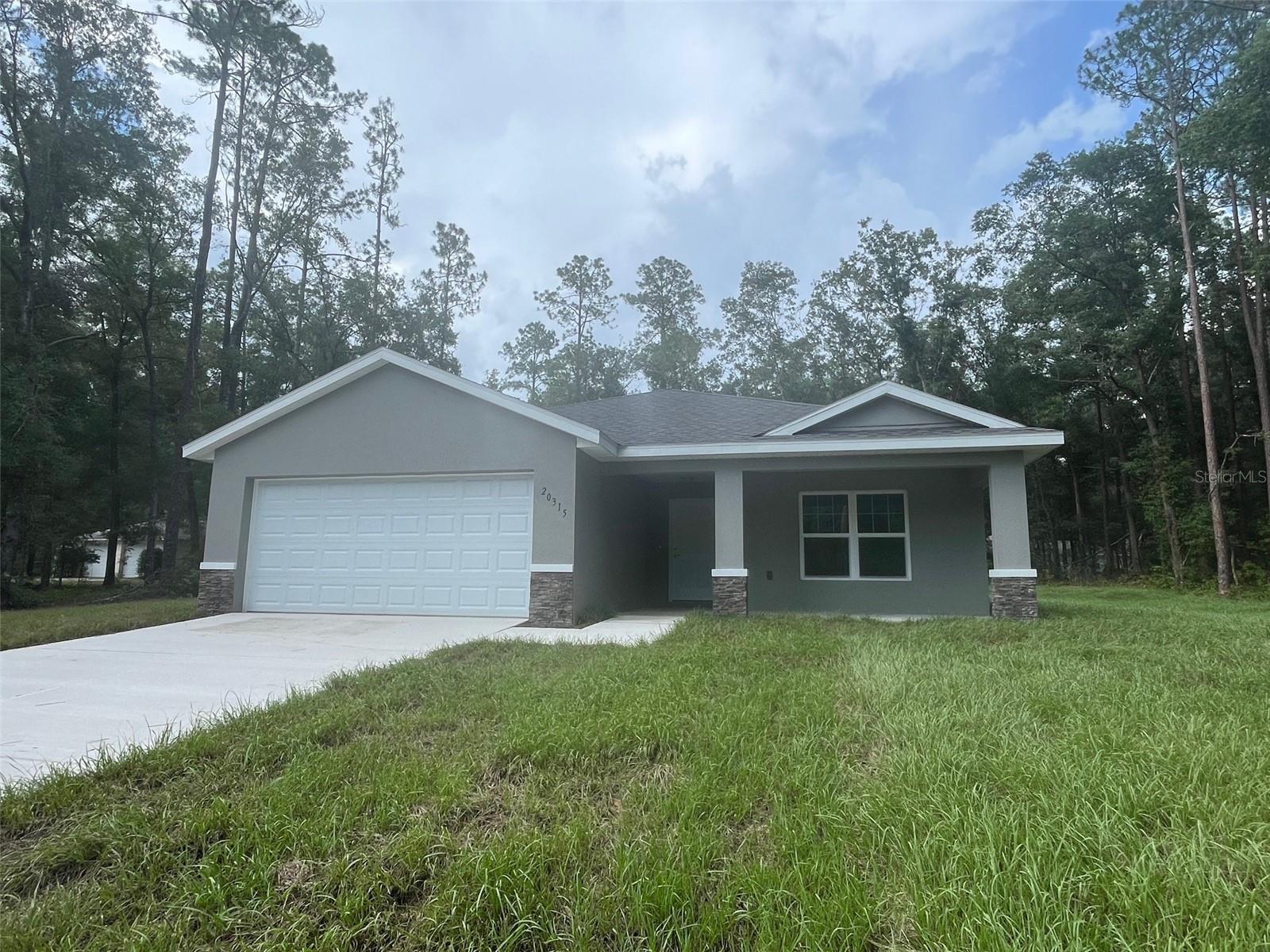 One or more photo(s) has been virtually staged. Under Construction. Beautiful new construction home on 1.19 acres in Rainbow Springs! Brand new everything, ready for you to make this house a home. Luxury Plank Vinyl flooring throughout all living areas & bedrooms, tile in bathrooms. Open floor plan, cathedral ceilings, dedicated dining room, walk in pantry, and large kitchen island area, all done in neutral, pleasing colors. Inside laundry with W & D hook-ups. Massive walk-in closet in Master bedroom and double vanity sinks in master bath. Stainless steel appliance package in the kitchen. This home has white shaker-style cabinets and light luxury granite countertops. Dining room overlooks lanai. Construction expected to be completed early May 2024. Pictures are of another home, same model. Home will have stacked stone on exterior. Please see attached documents from Builder (Builders Contract Addendum & Warranty) Actual photos are currently unavailable. Any photos depicted are for illustration purposes only and only to show layout. Floor plan displayed is our standard plan and garage orientation may vary on actual home. Interior and exterior colors, finishes, and garage orientation will vary for actual home. Information is deemed correct, but no guarantee made. The home is under construction. Expected completion date is an estimate only. Any dimensions listed are approximate.