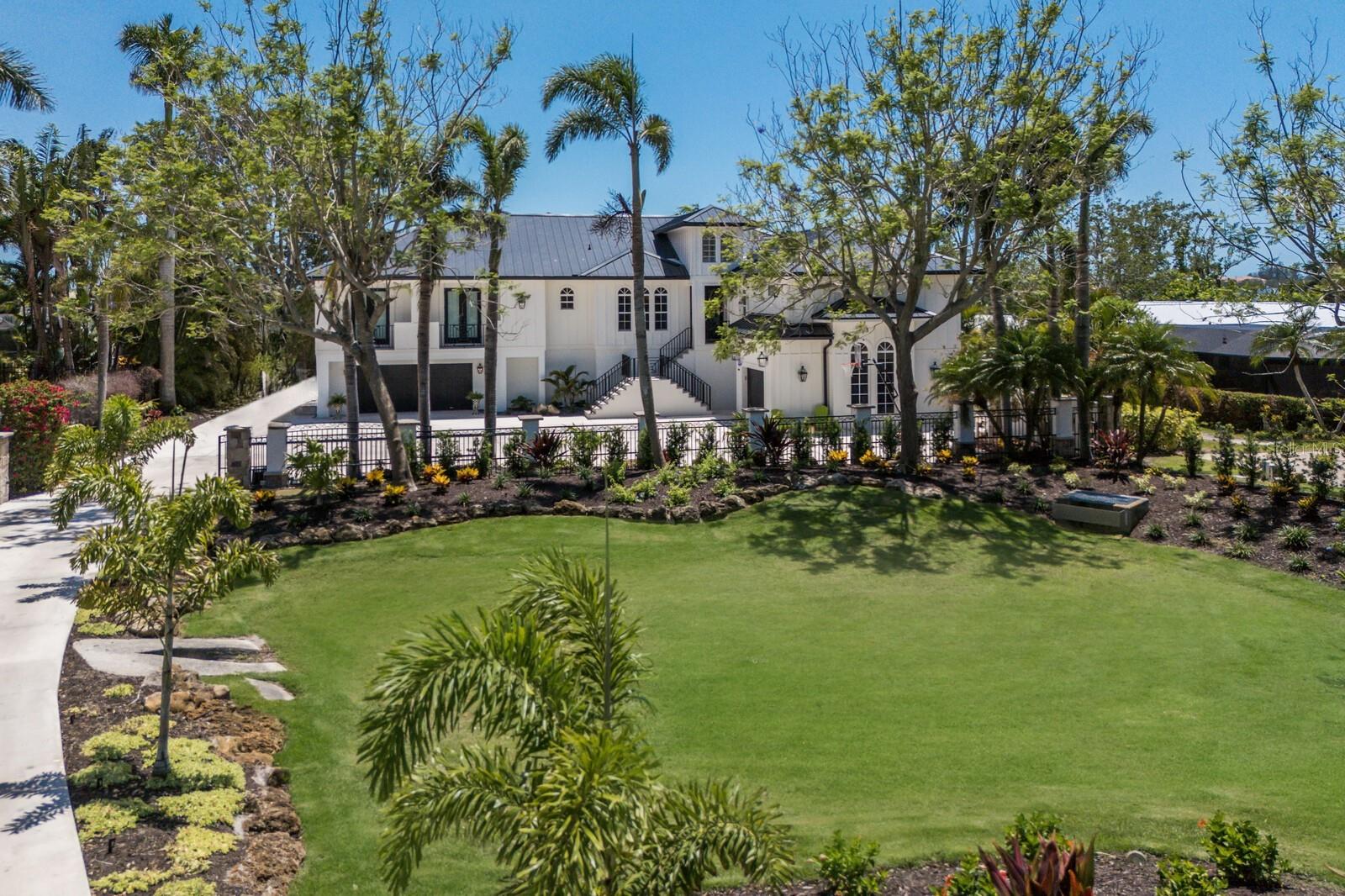 A MASTERPIECE OF LUXURY AND DESIGN! EXQUISITE TROPICAL WATERFRONT ESTATE ON PALMA SOLA BAY! Welcome to one of the most extraordinary residences in all of Northwest Bradenton—an absolutely breathtaking tropical estate nestled directly on the serene waters of Palma Sola Bay.Completely reimagined and rebuilt in 2021 by the esteemed Kleppinger Construction,this GATED, PRIVATE sanctuary is a true work of art,where no detail was overlooked and no expense spared.Boasting 5 bedrooms, 5.5 bathrooms, and 5,447 sq ft of elevated living space (12,332 sq ft total),this custom-designed estate offers the ultimate in privacy, sophistication, and coastal living.Nearly every element of the home is brand new—from the metal roof, Hardyboard siding,to the elevated resort-style pool and spa,new A/C's, elevator and beyond.Step inside and experience timeless elegance,where refined finishes,custom millwork,& high-end materials blend seamlessly with sun-drenched interiors.Massive picture windows frame panoramic bay views, flooding every room with natural light and connecting you to the beauty of your surroundings.The interior layout is both grand & functional, featuring a formal dining room, a spacious family room just off the kitchen,a large secondary TV lounge,and an expansive media and movie theater.The kitchen is spectacular—designed for those who love to cook, gather, & entertain.Adorned with custom white cabinetry with elegant gold hardware, this kitchen features full-height backsplashes, expansive countertops, & professional appliances including a commercial AGA range, double Wolf wall ovens, & a built-in Subzero refrigerator.A massive center island offers seating, a prep sink, built-in microwave, and dramatic pendant lighting, while thoughtful touches like a pot filler,and under-cabinet lighting elevates the space to world-class standards.Retreat to the spa-inspired primary suite, an oasis of peace and luxury. With custom wide plank flooring,extensive millwork,oversized windows,and space for a sitting area or home gym,this suite was designed with comfort and beauty in mind.The lavish en-suite bath features a freestanding soaking tub, frameless glass walk-in shower with dual rainfall heads, dual vanities with designer mirrors and gold fixtures.Upstairs, a dedicated office with sweeping water views offers an inspiring place to work, while the expansive laundry room provides ample storage, cabinetry, and a utility sink. Step outside into your private outdoor paradise,where the elevated, screened-in pool deck becomes an extension of your living space.The picture-frame screen enclosure allows unobstructed water views,while lush landscaping ensures privacy.The sparkling pool and spa are surrounded by generous lounge areas & and a stunning outdoor kitchen—featuring stainless steel appliances, a built-in grill and flattop, & beverage coolers.The estate continues beyond with a brand-new dock, including a 30,000 lb boat lift with roof, offering deep water access to the Intracoastal Waterway and Gulf.The ground level is nothing short of a car collector’s fantasy, featuring 5 designated garage bays and over 5,000 sq ft of additional storage,workshop, or recreation space. Located just minutes from IMG ACADEMY, ST STEPHENS & the sugar-sand beaches of ANNA MARIA ISLAND and only steps from Robinson Preserve, a 682-acre coastal sanctuary with kayak launches and nature trails.This is more than a home—it’s a legacy estate designed for luxury, lifestyle, & lasting memories.