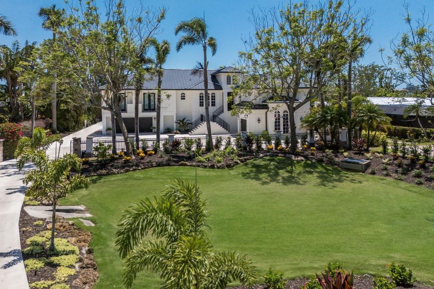 A MASTERPIECE OF LUXURY AND DESIGN! EXQUISITE TROPICAL WATERFRONT ESTATE ON PALMA SOLA BAY! Welcome to one of the most extraordinary residences in all of Northwest Bradenton—an absolutely breathtaking tropical estate nestled directly on the serene waters of Palma Sola Bay.Completely reimagined and rebuilt in 2021 by the esteemed Kleppinger Construction,this GATED, PRIVATE sanctuary is a true work of art,where no detail was overlooked and no expense spared.Boasting 5 bedrooms, 5.5 bathrooms, and 5,447 sq ft of elevated living space (12,332 sq ft total),this custom-designed estate offers the ultimate in privacy, sophistication, and coastal living.Nearly every element of the home is brand new—from the metal roof, Hardyboard siding,to the elevated resort-style pool and spa,new A/C's, elevator and beyond.Step inside and experience timeless elegance,where refined finishes,custom millwork,& high-end materials blend seamlessly with sun-drenched interiors.Massive picture windows frame panoramic bay views, flooding every room with natural light and connecting you to the beauty of your surroundings.The interior layout is both grand & functional, featuring a formal dining room, a spacious family room just off the kitchen,a large secondary TV lounge,and an expansive media and movie theater.The kitchen is spectacular—designed for those who love to cook, gather, & entertain.Adorned with custom white cabinetry with elegant gold hardware, this kitchen features full-height backsplashes, expansive countertops, & professional appliances including a commercial AGA range, double Wolf wall ovens, & a built-in Subzero refrigerator.A massive center island offers seating, a prep sink, built-in microwave, and dramatic pendant lighting, while thoughtful touches like a pot filler,and under-cabinet lighting elevates the space to world-class standards.Retreat to the spa-inspired primary suite, an oasis of peace and luxury. With custom wide plank flooring,extensive millwork,oversized windows,and space for a sitting area or home gym,this suite was designed with comfort and beauty in mind.The lavish en-suite bath features a freestanding soaking tub, frameless glass walk-in shower with dual rainfall heads, dual vanities with designer mirrors and gold fixtures.Upstairs, a dedicated office with sweeping water views offers an inspiring place to work, while the expansive laundry room provides ample storage, cabinetry, and a utility sink. Step outside into your private outdoor paradise,where the elevated, screened-in pool deck becomes an extension of your living space.The picture-frame screen enclosure allows unobstructed water views,while lush landscaping ensures privacy.The sparkling pool and spa are surrounded by generous lounge areas & and a stunning outdoor kitchen—featuring stainless steel appliances, a built-in grill and flattop, & beverage coolers.The estate continues beyond with a brand-new dock, including a 30,000 lb boat lift with roof, offering deep water access to the Intracoastal Waterway and Gulf.The ground level is nothing short of a car collector’s fantasy, featuring 5 designated garage bays and over 5,000 sq ft of additional storage,workshop, or recreation space. Located just minutes from IMG ACADEMY, ST STEPHENS & the sugar-sand beaches of ANNA MARIA ISLAND and only steps from Robinson Preserve, a 682-acre coastal sanctuary with kayak launches and nature trails.This is more than a home—it’s a legacy estate designed for luxury, lifestyle, & lasting memories.