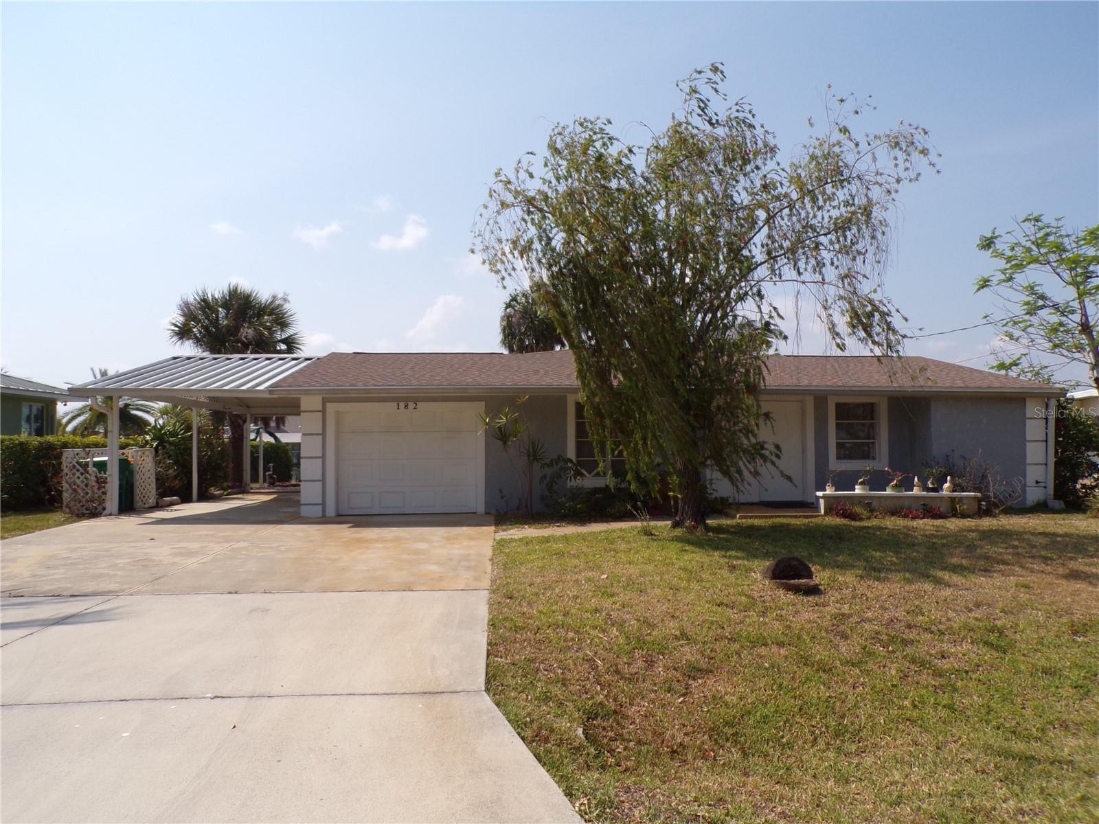 This quaint 2 bedroom, 2 bath home with GULF ACCESS is just what you are looking for! Enjoy views of 80 ft canal footage with concrete seawall and dock. This home is light and bright, tile floors throughout and plenty of space for entertaining. It features a one car garage as well as a covered 2 car carport. Furniture optional.