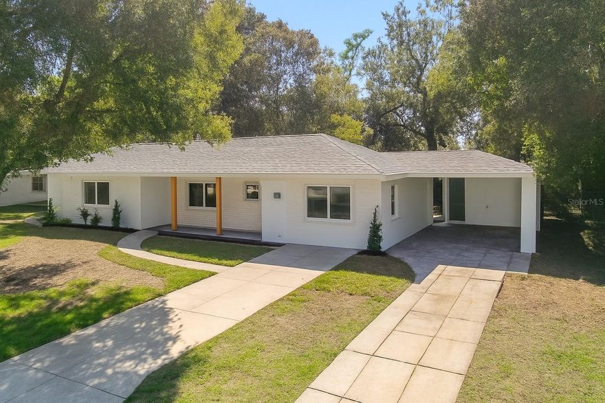 PRIVATE-ENTRY GUEST/IN-LAW SUITE with its own kitchenette and bath—ideal for extended family, guests, or income-producing potential! NO HOA! This beautifully renovated block-built home blends classic construction with modern comfort. Fully permitted 2025 renovation includes new plumbing, electrical, windows, doors, HVAC, plus a 2023 roof for peace of mind.

Inside, the split floorplan offers excellent flow with modern flooring, fresh paint, and updated contemporary fixtures. Both the main home and the guest suite are professionally furnished, and furnishings can convey with a full-price offer. Additional features include an indoor laundry room, spacious Florida room, outdoor storage, mature trees, a carport, and abundant parking.

Located in a quiet Eustis neighborhood close to parks, schools, hospitals, shopping, and dining. Seller is offering $10,000 toward buyer’s closing costs and prepaids with an acceptable offer. Turn-key and flexible—don’t miss this one!