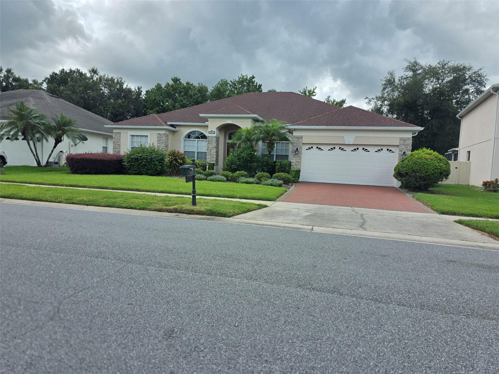 A very beautiful 4Bedrooms/3bathrooms/2 Car garage with screen enclosed patio in gated Preserve Community on East Orlando. Home had roof and paver replace in 2020, AC replace in 2019, and 6 new windows in 2018. House had a lot upgrades, hardwood floor on all bedrooms, living room, and dining room, stainless steel appliances: refrigerator, range, and microwave, 42'' kitchen cabinets, granite countertop and stylish golden kitchen faucet. Community amenities included Club house, fitness center, community pool, playground, tennis and basketball court, and walking trail. Very convenient about 8 minutes to Valencia College, 15 minutes to UCF, Waterford Lake Town Shopping Center and Orlando International Airport, and about 20 minutes to Downtown Orlando. Very easy to access to highway 417 & 408. Call to schedule for a Tour.